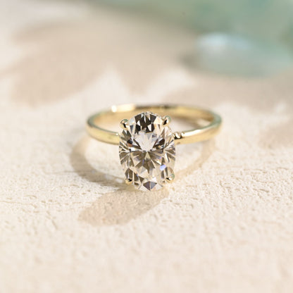 solid-gold-oval-cut-moissanite-engagement-ring-hidden-halo