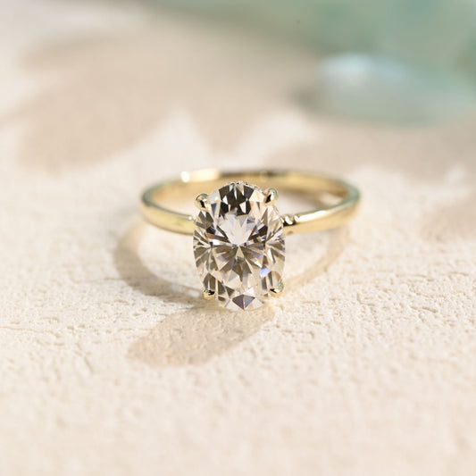 solid-gold-oval-cut-moissanite-engagement-ring-hidden-halo