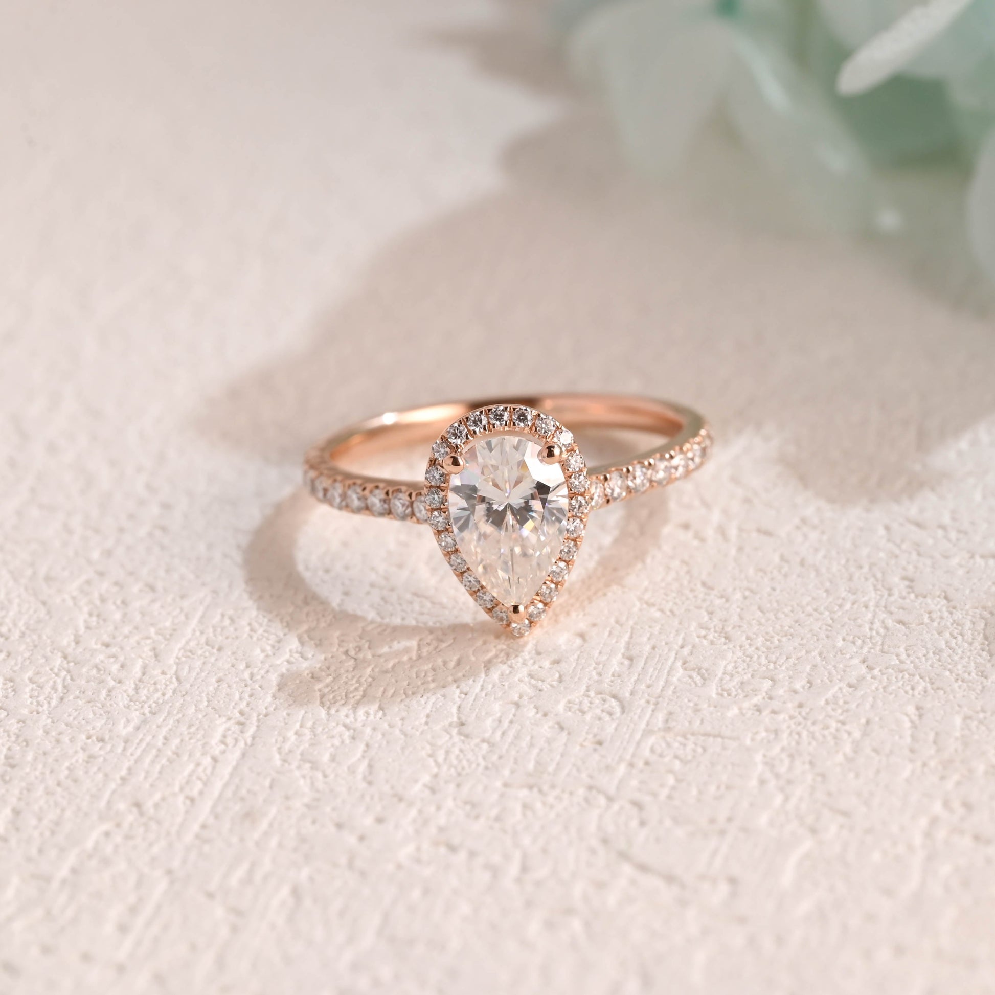 solid-gold-pear-cut-moissanite-engagement-ring-cathedral-ring