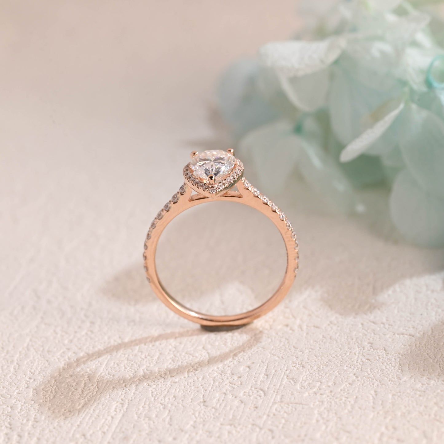 solid-gold-pear-cut-moissanite-engagement-ring-cathedral-ring