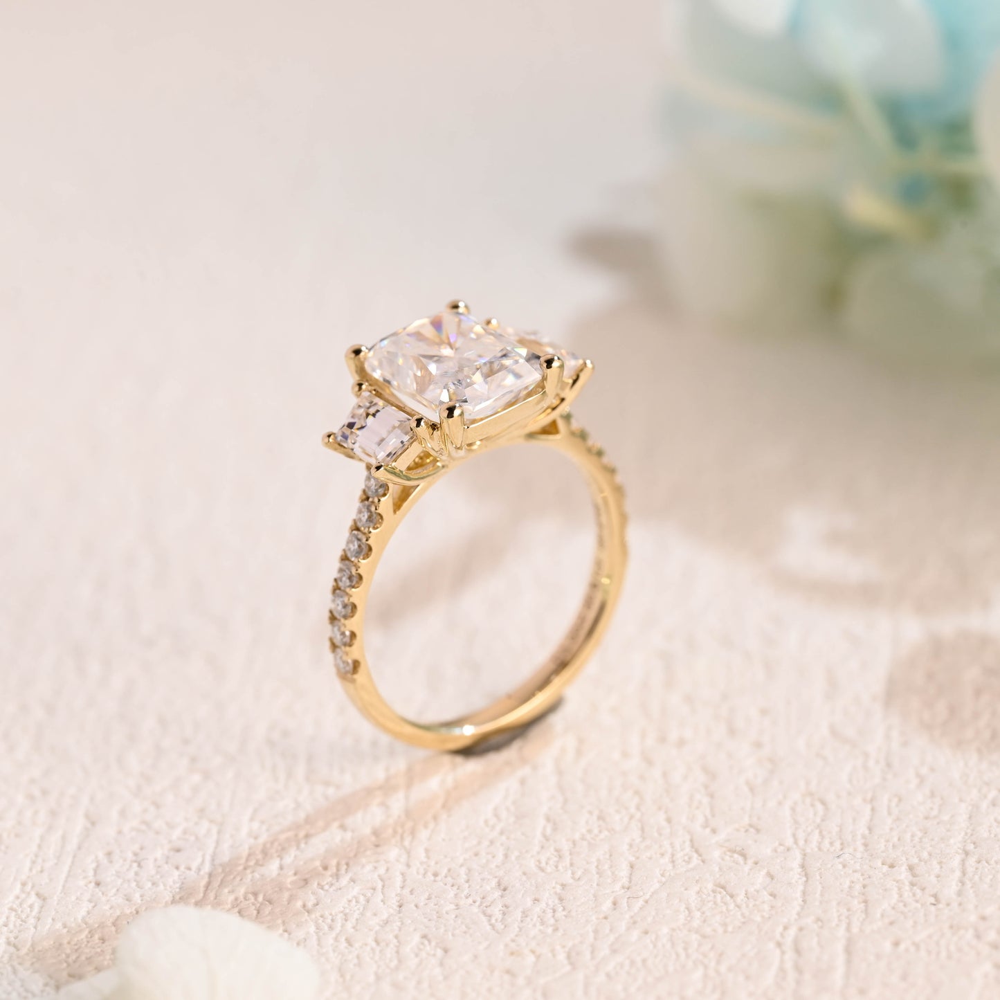 Solid-gold-radiant-cut-moissanite-engagement-ring-three-stone-ring