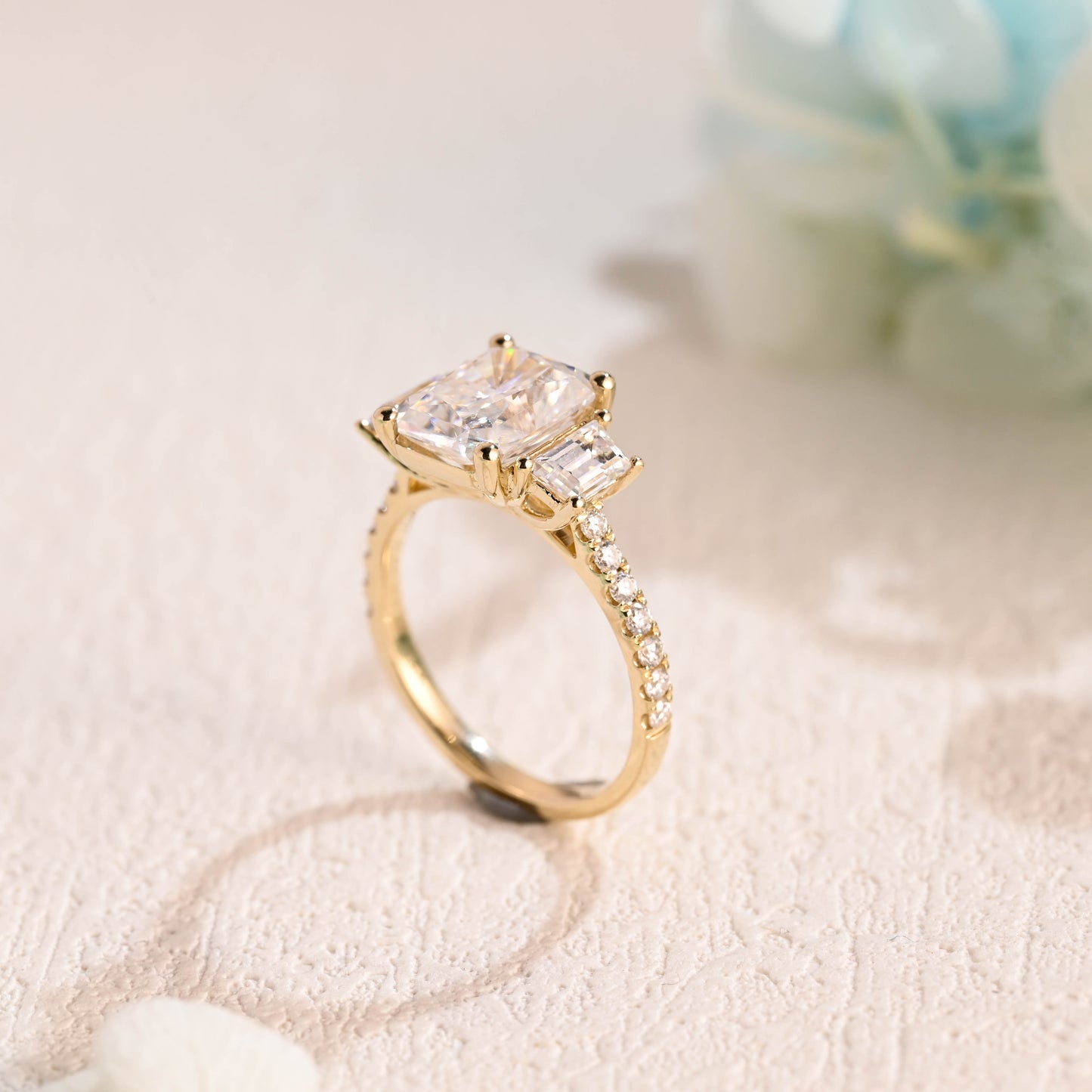 Solid-gold-radiant-cut-moissanite-engagement-ring-three-stone-ring