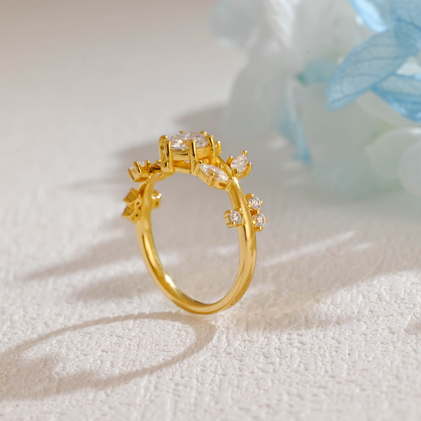 solid-gold-round-cut-moissanite-engagement-ring-side-stone-marquise-cut-ring-leaf-ring