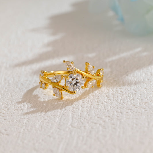 solid-gold-round-cut-moissanite-engagement-ring-side-stone-marquise-cut-ring-leaf-ring