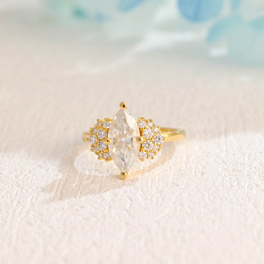 solid-gold-marquise-cut-moissanite-engagement-ring-side-stone-round-ring-cluster-ring