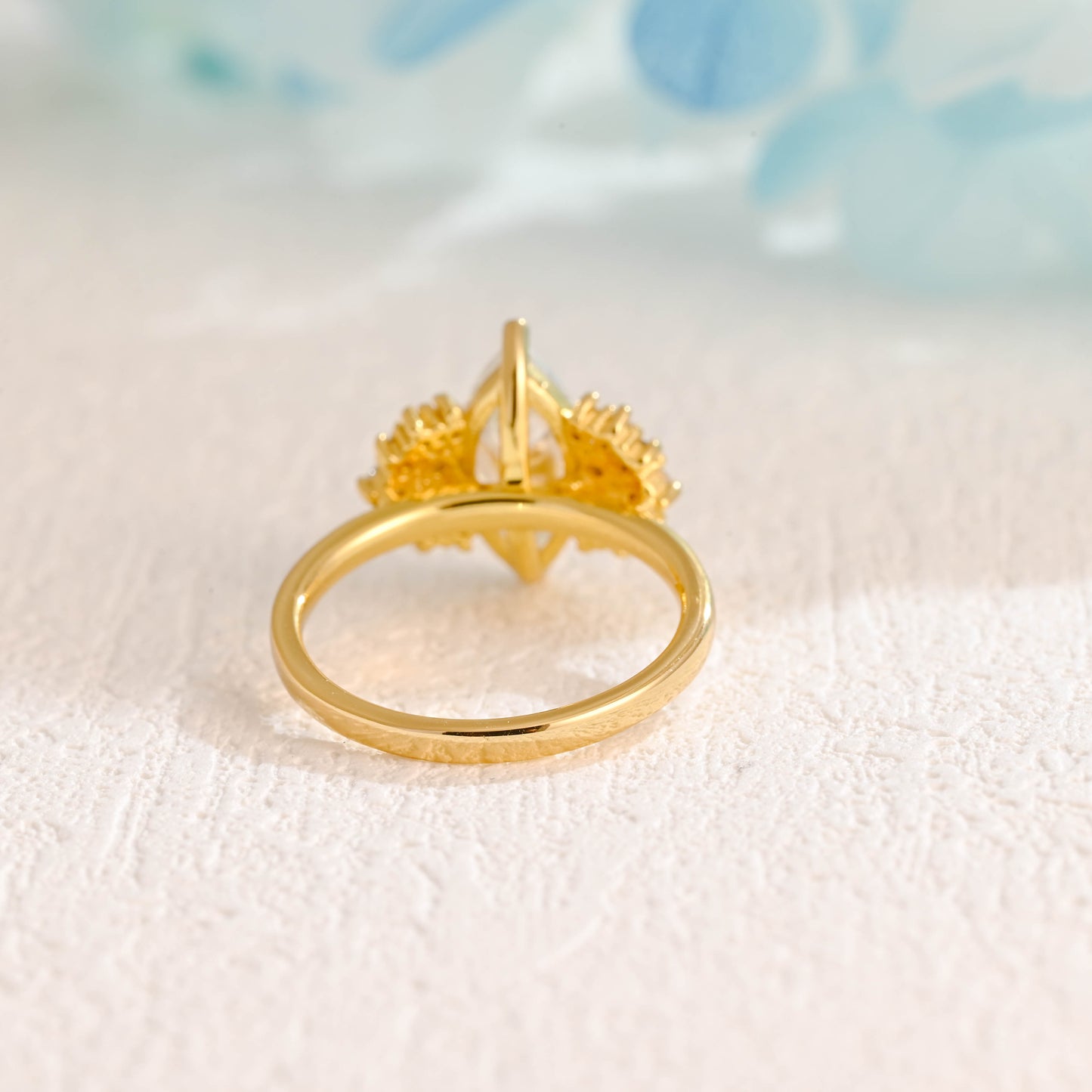 solid-gold-marquise-cut-moissanite-engagement-ring-side-stone-round-ring-cluster-ring