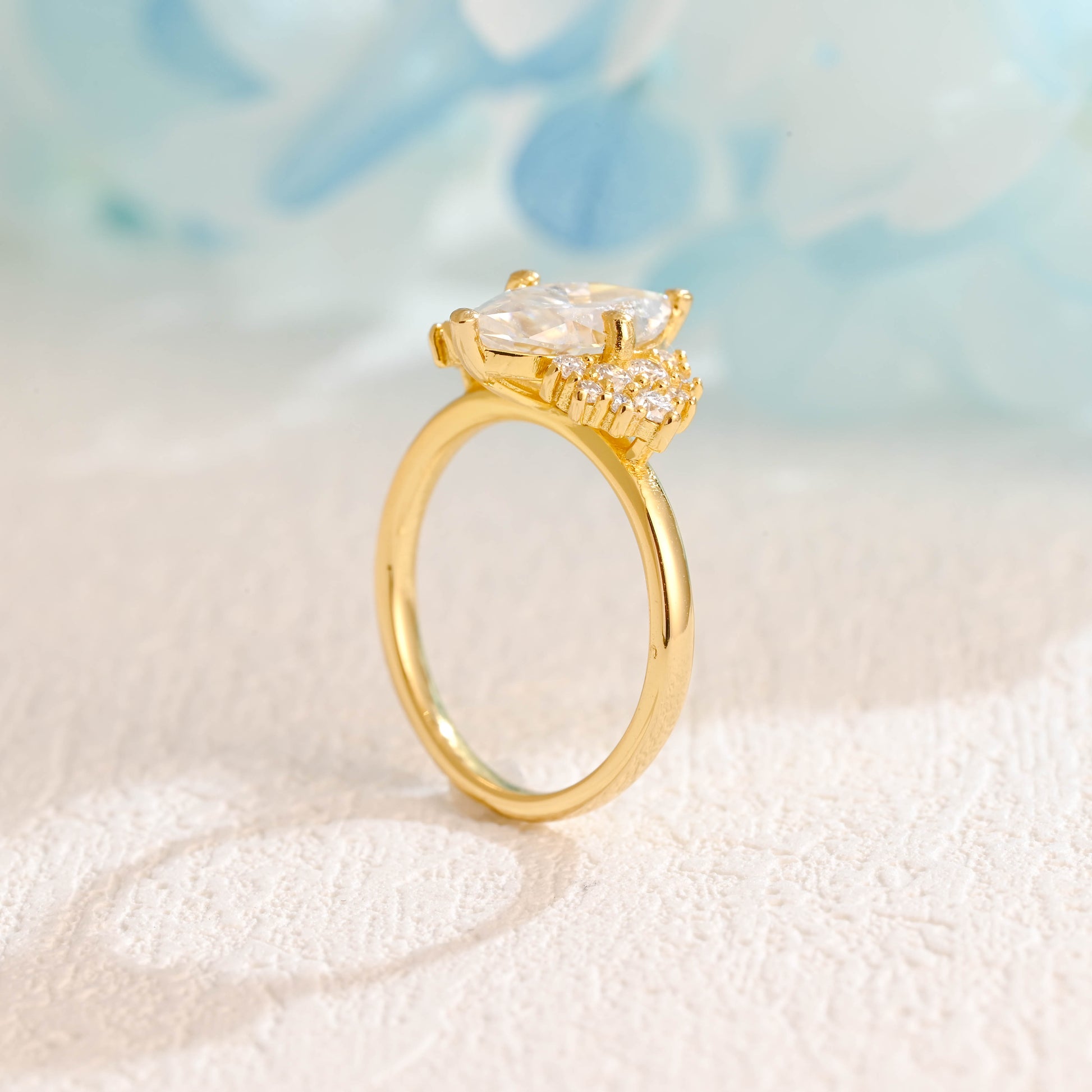 solid-gold-marquise-cut-moissanite-engagement-ring-side-stone-round-ring-cluster-ring