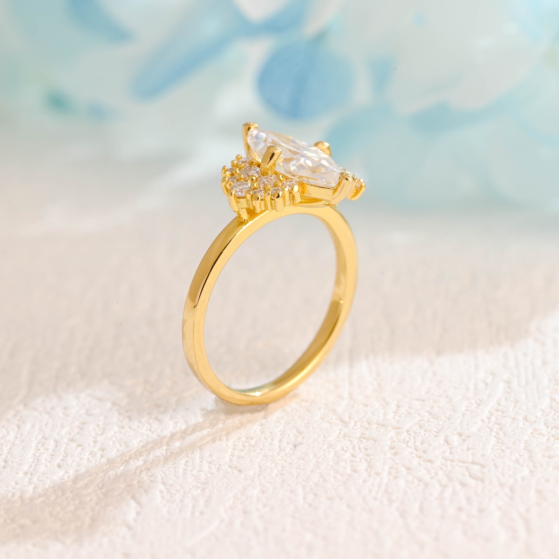 solid-gold-marquise-cut-moissanite-engagement-ring-side-stone-round-ring-cluster-ring