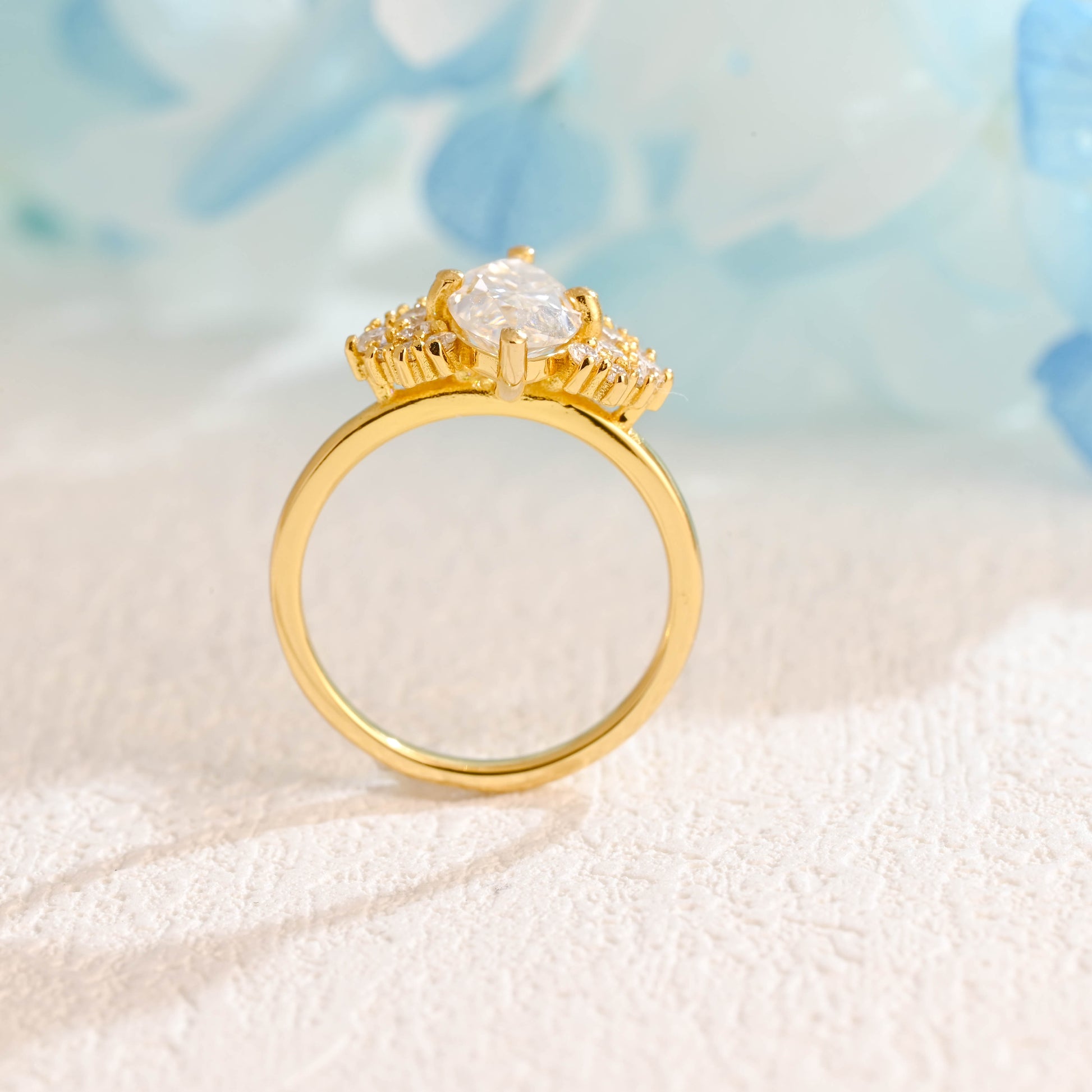 solid-gold-marquise-cut-moissanite-engagement-ring-side-stone-round-ring-cluster-ring