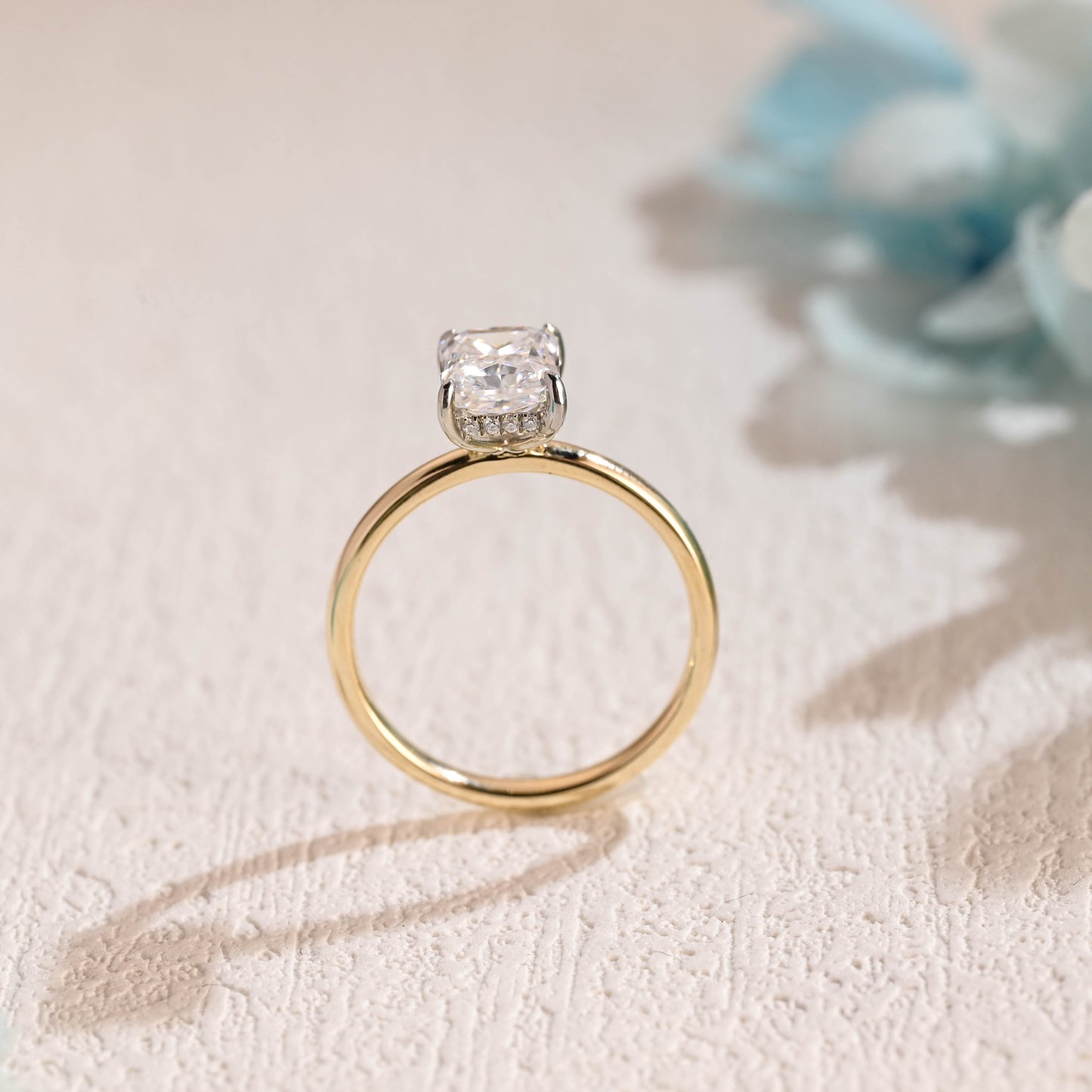 solid-gold-two-tone-crushed-ice-radiant-cut-moissanite-engagement-ring-hidden-halo