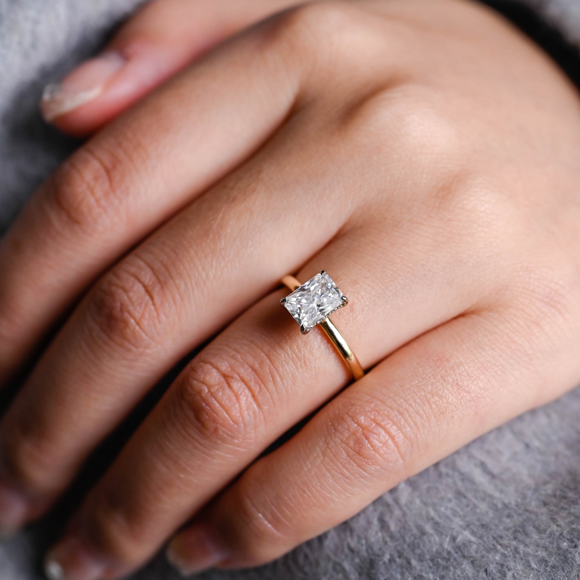 solid-gold-two-tone-crushed-ice-radiant-cut-moissanite-engagement-ring-hidden-halo