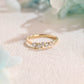 solid-gold-curved-round-cut-moissanite-wedding-band