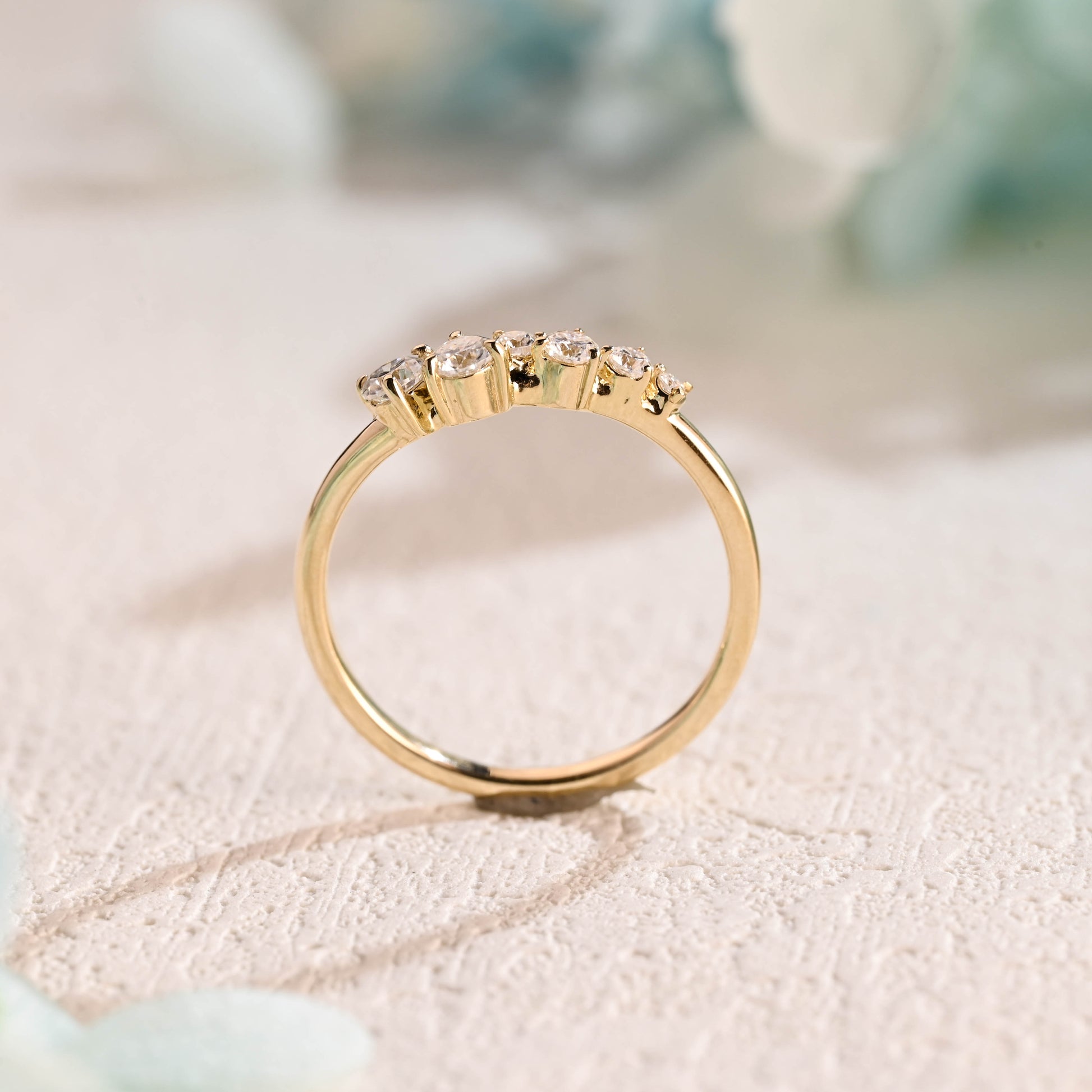 solid-gold-curved-round-cut-moissanite-wedding-band