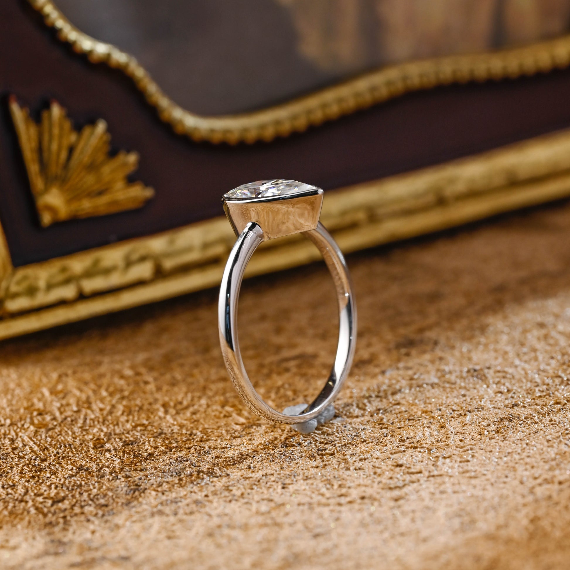 solid-gold-pear-cut-diamond-ring-bezel-ring