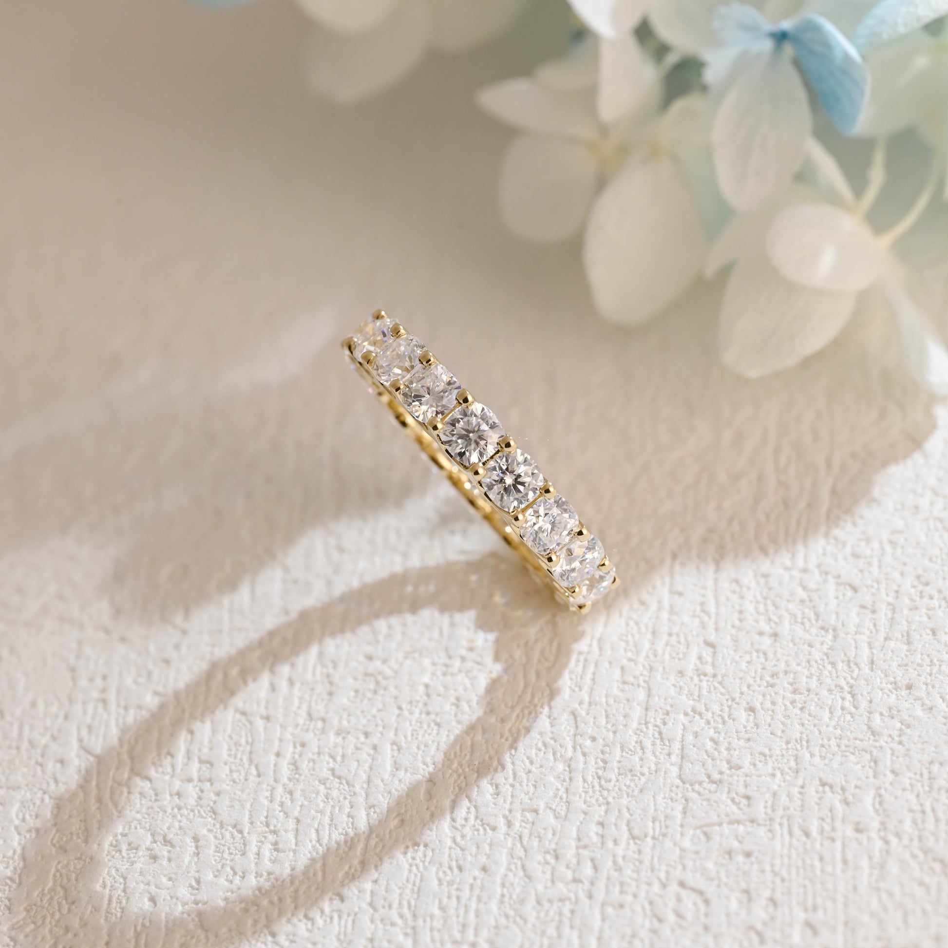 solid-gold-cushion-cut-moissanite-wedding-ring-full-eternity-wedding-band