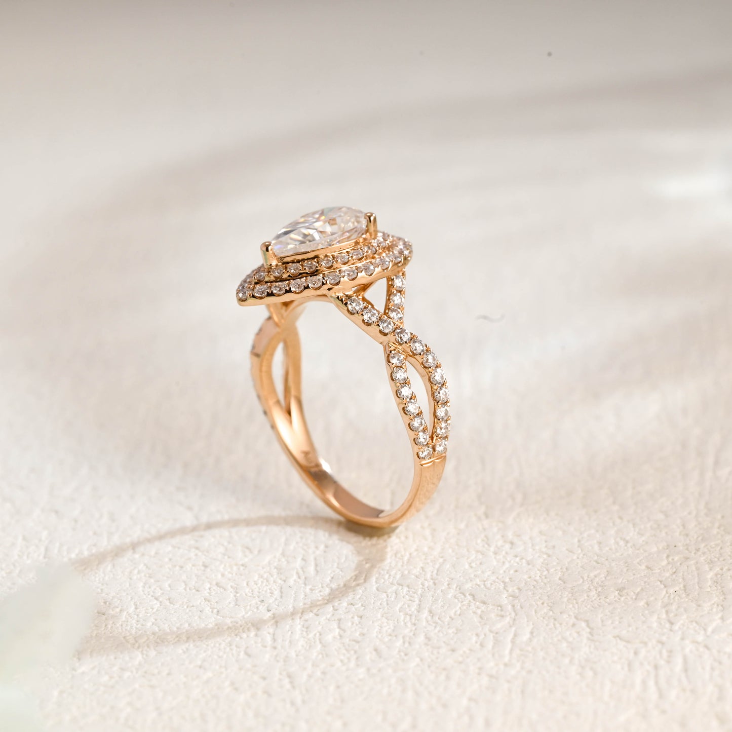 solid-gold-pear-cut-moissanite-engagement-ring-double-halo-ring-twisted-band-ring