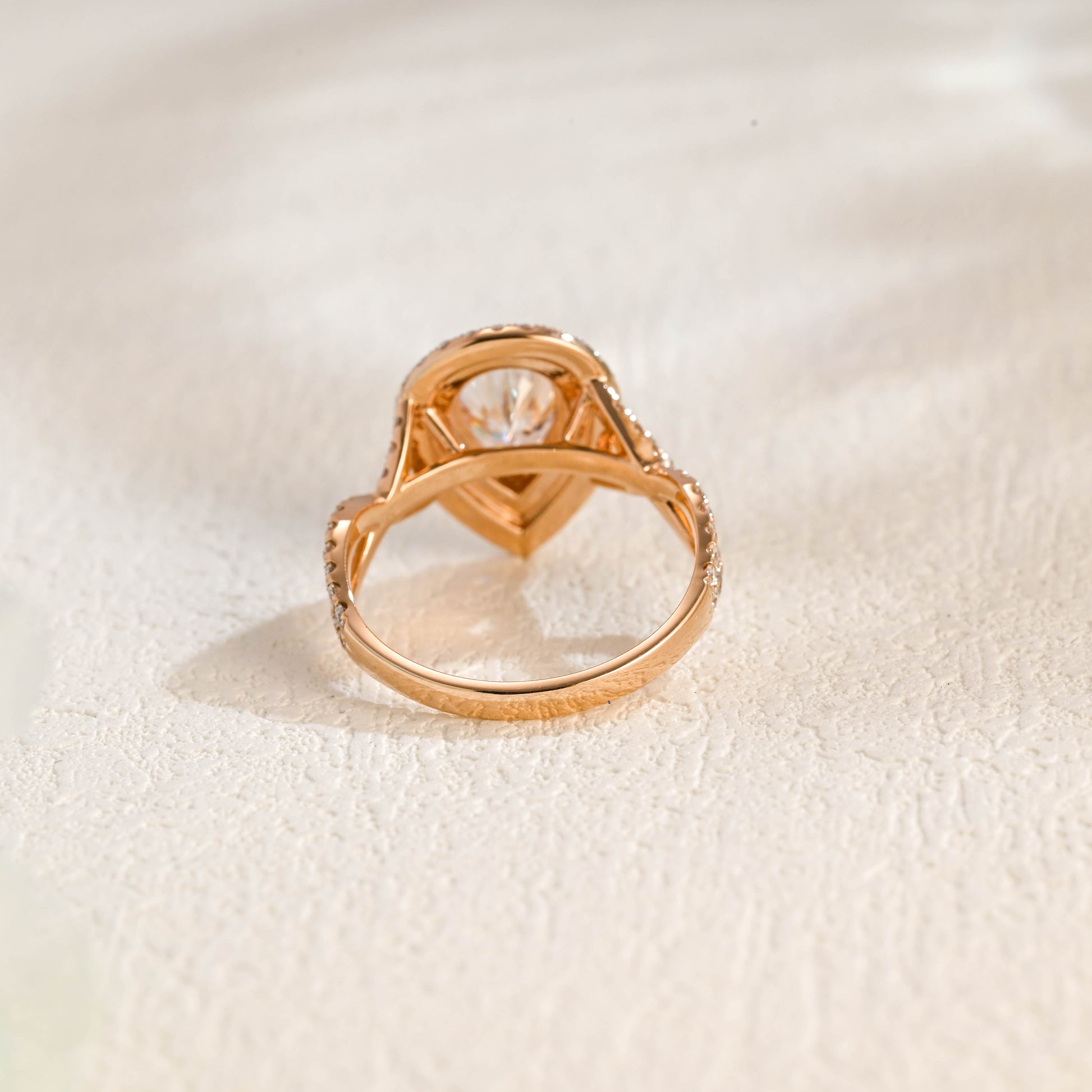 solid-gold-pear-cut-moissanite-engagement-ring-double-halo-ring-twisted-band-ring