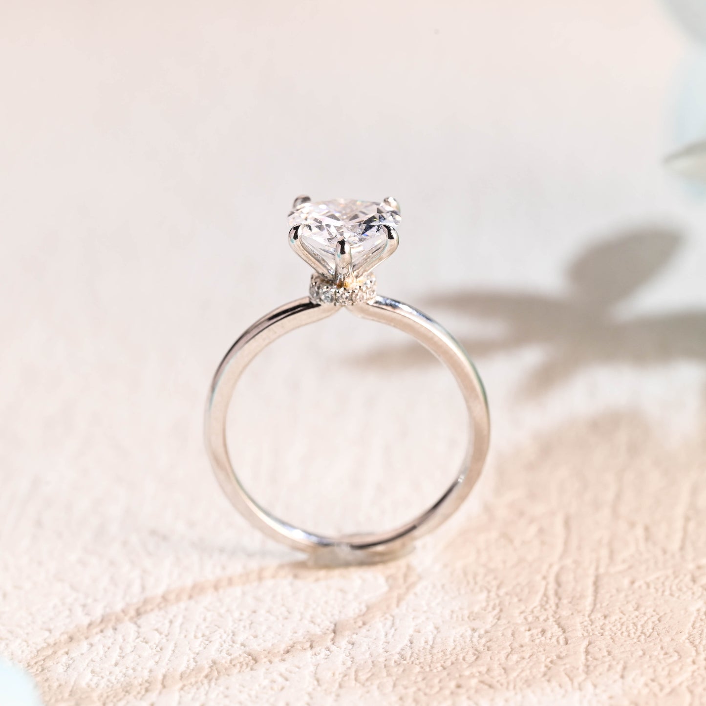 solid-gold-heart-cut-moissanite-engagement-ring-hidden-halo