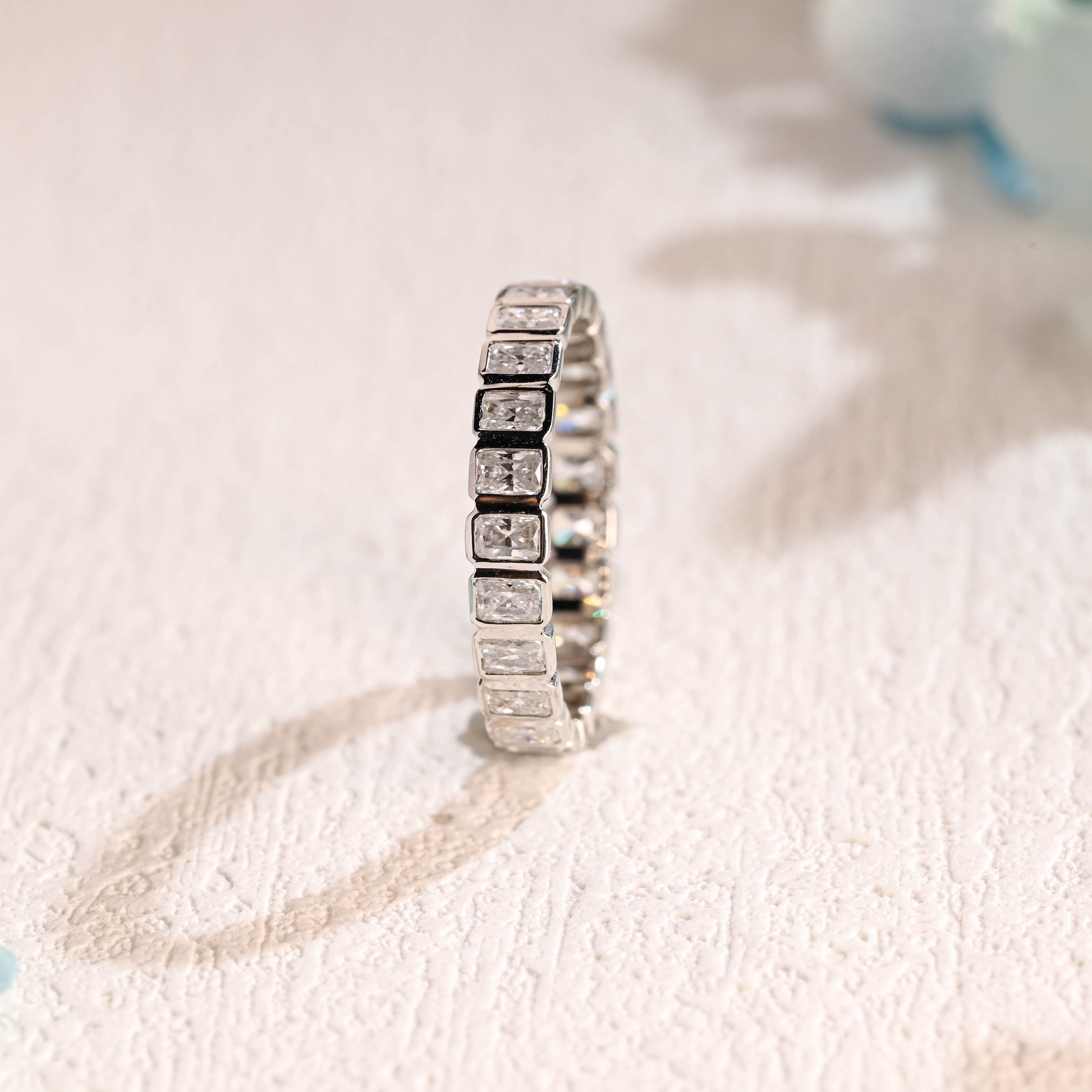 solid-gold-full-eternity-radiant-cut-moissanite-wedding-band-bezel-ring