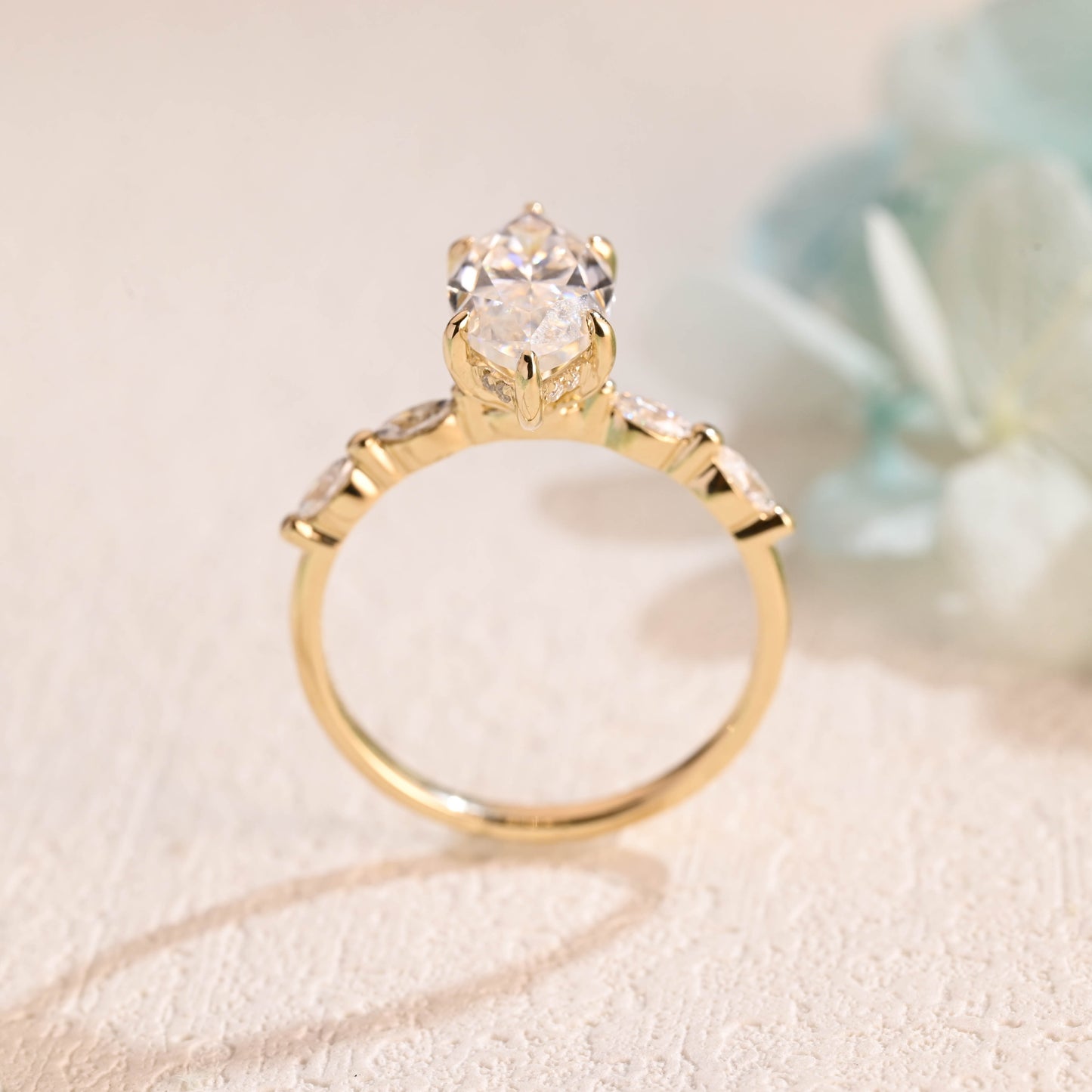 solid-gold-marquise-cut-moissanite-engagement-ring-hidden-halo