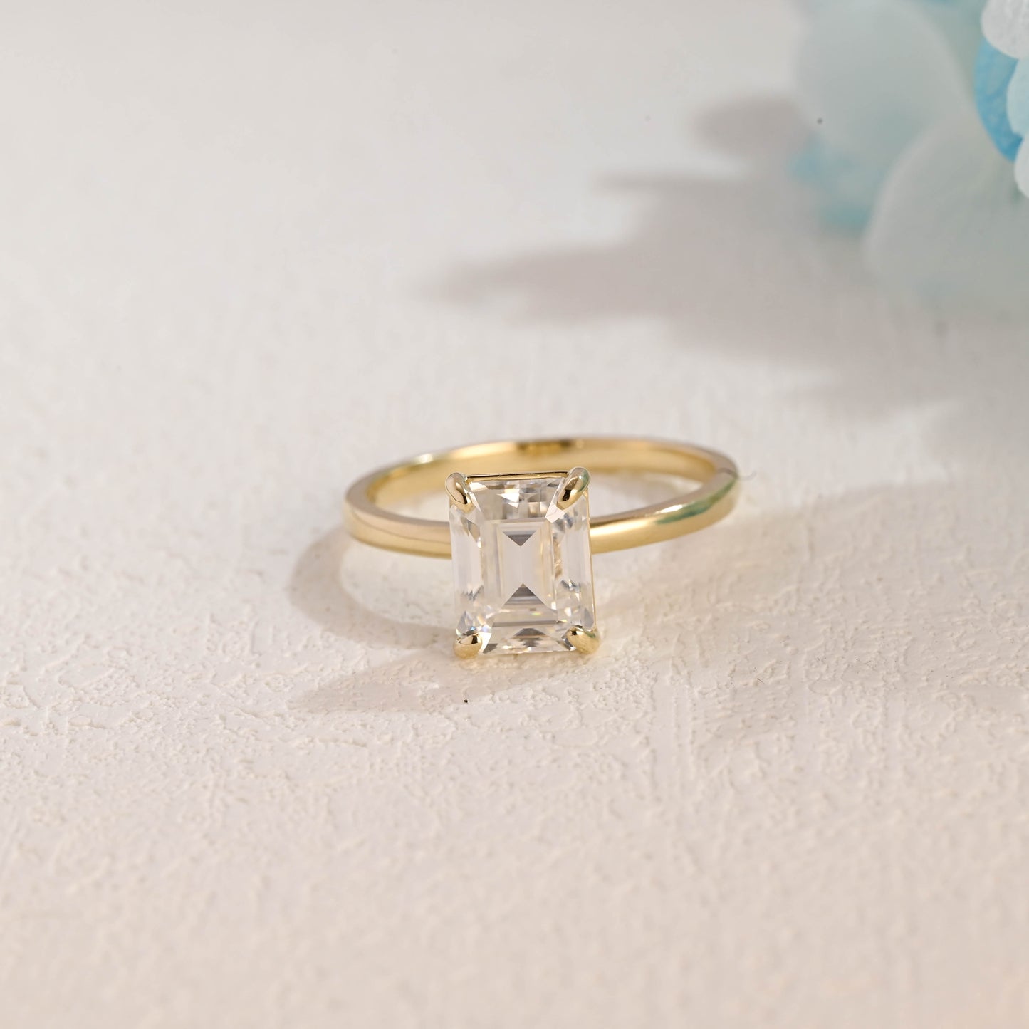 solid-gold-solitaire-emerald-cut-moissanite-engagement-ring