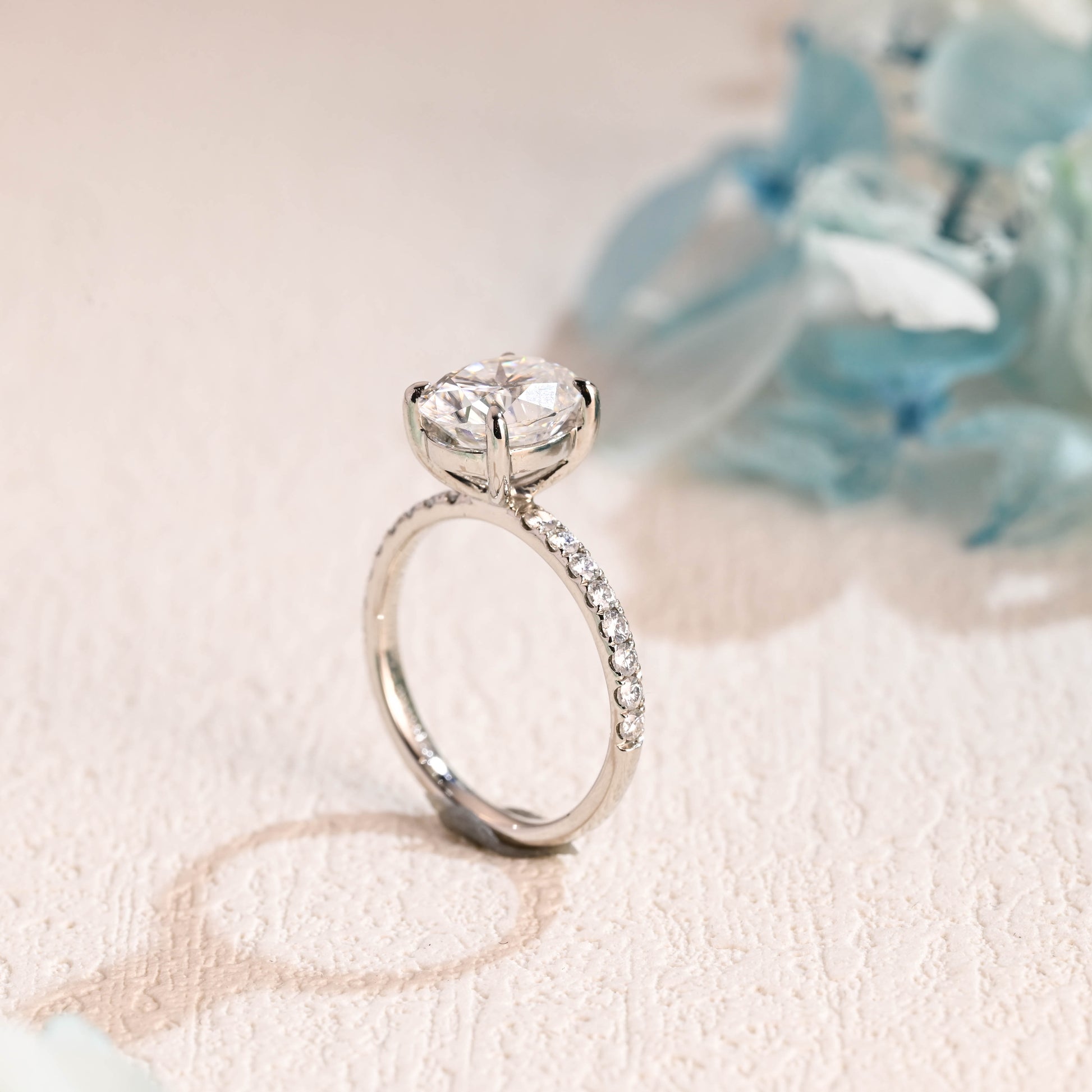 half-pave-oval-moissanite-engagement-ring