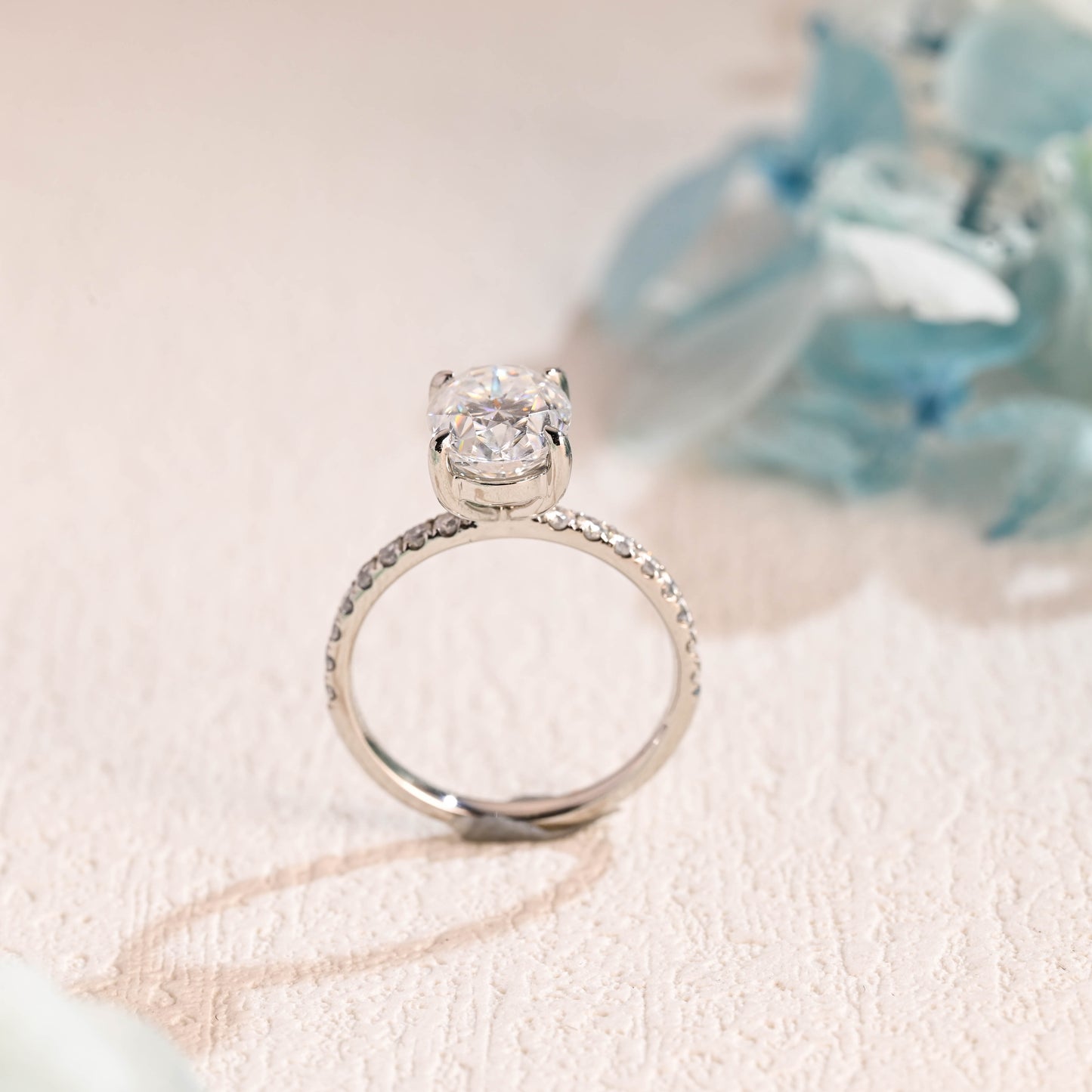 half-pave-oval-moissanite-engagement-ring