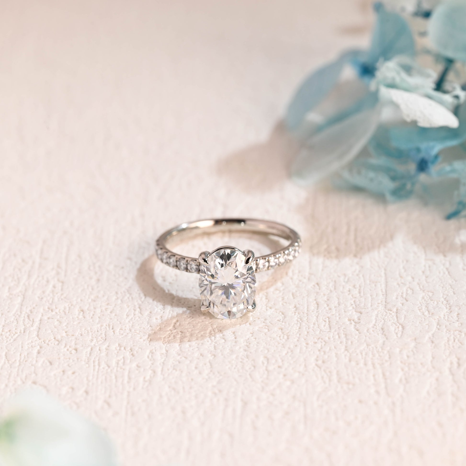 half-pave-oval-moissanite-engagement-ring