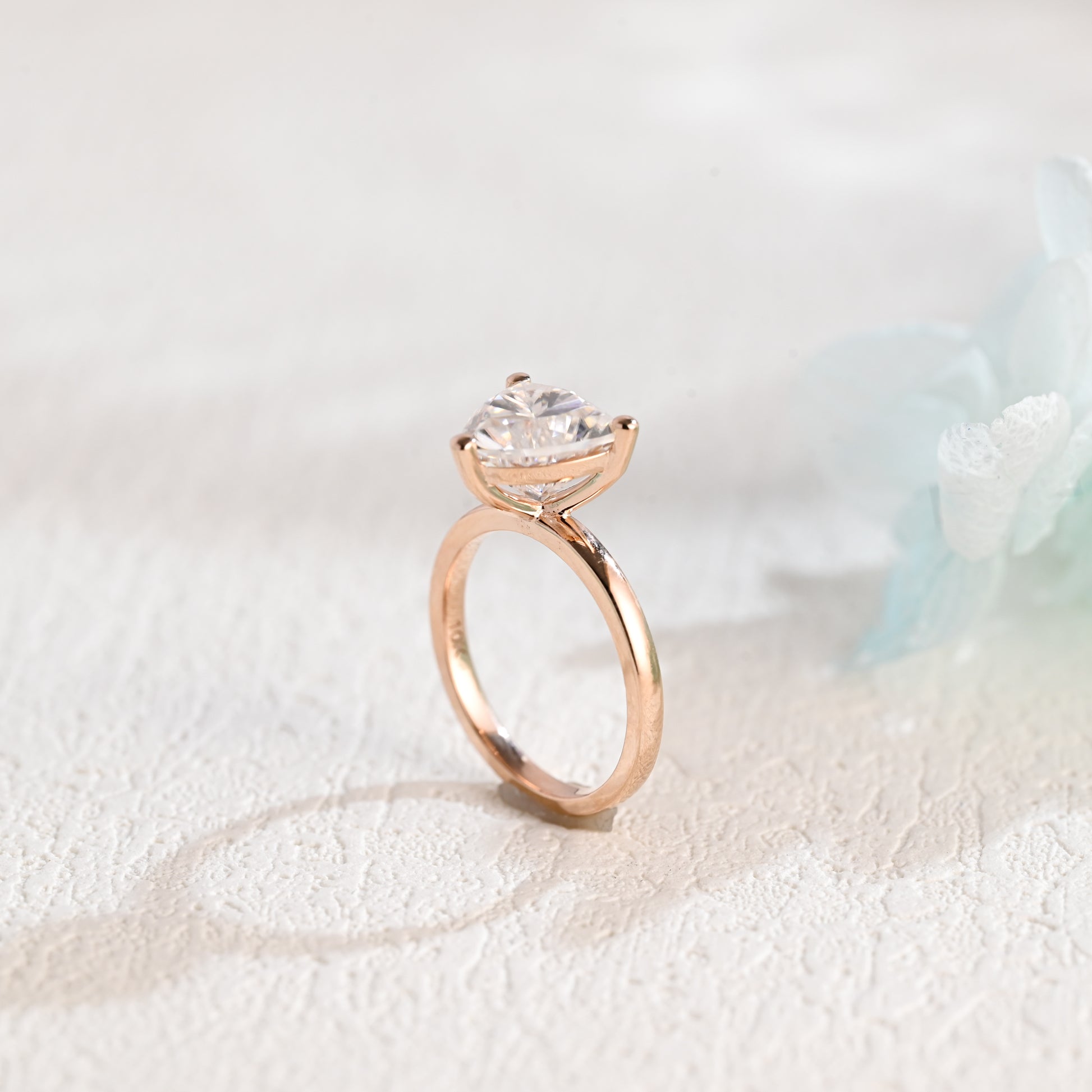 solid-gold-solitaire-Trilliant-moissanite-engagement-ring