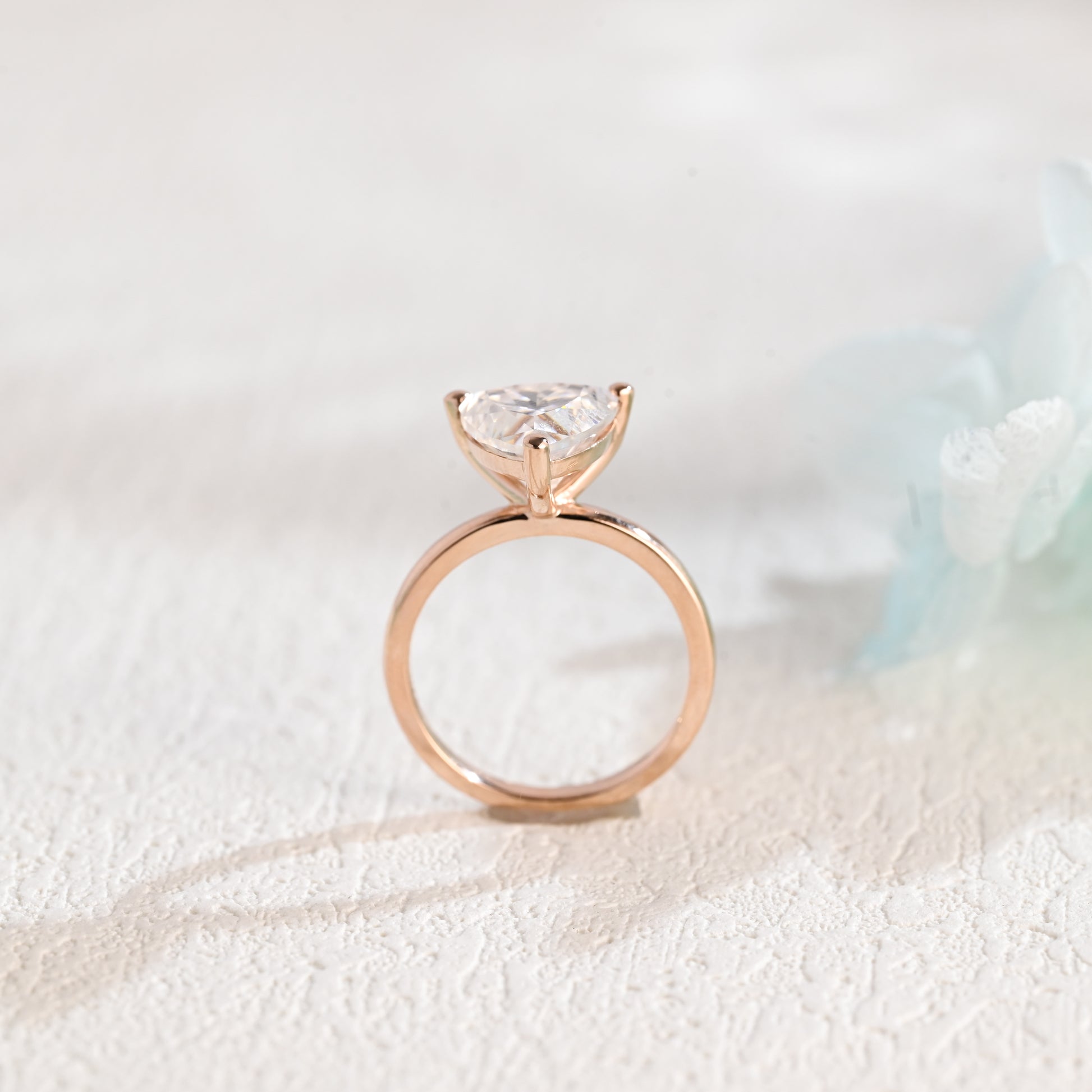 solid-gold-solitaire-Trilliant-moissanite-engagement-ring