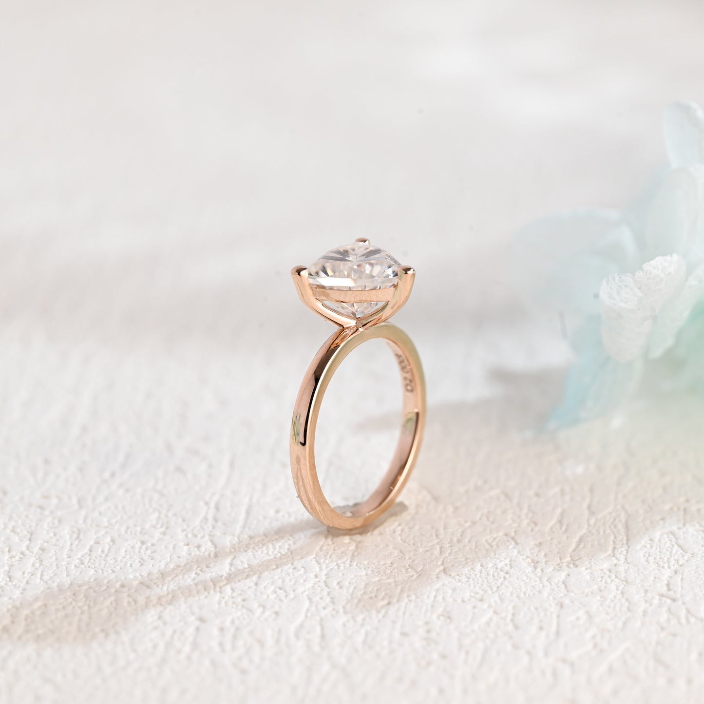 solid-gold-solitaire-Trilliant-moissanite-engagement-ring