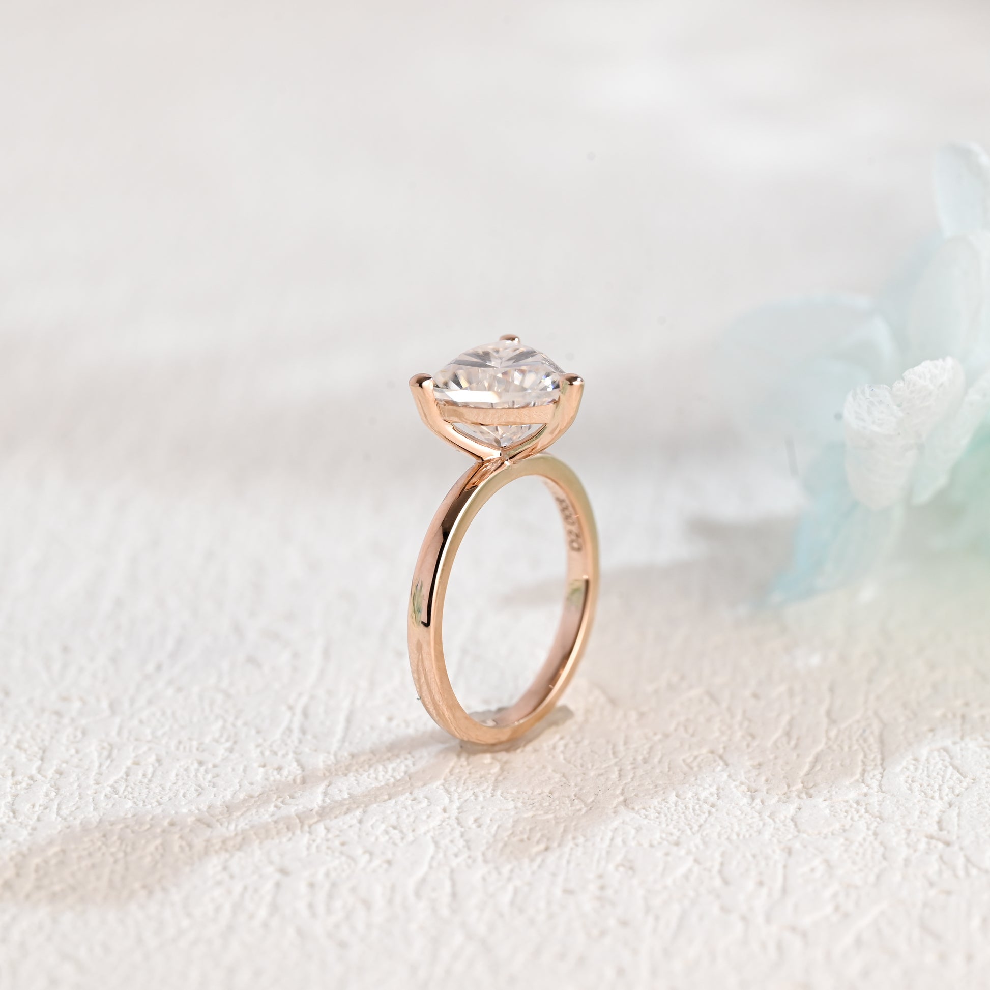 solid-gold-solitaire-Trilliant-moissanite-engagement-ring