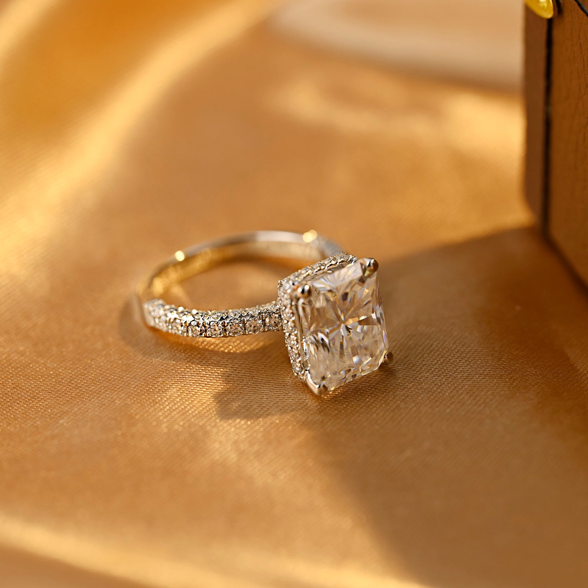 solid-gold-radiant-cut-moissanite-engagement-ring-three-raw-paved-ring