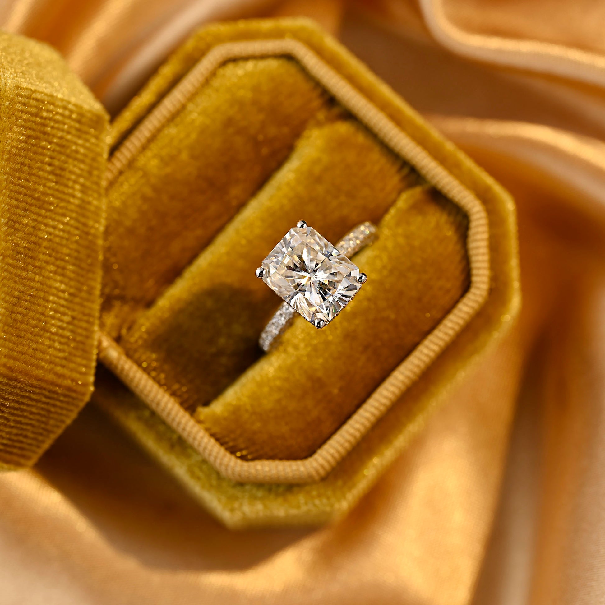 solid-gold-radiant-cut-moissanite-engagement-ring-three-raw-paved-ring