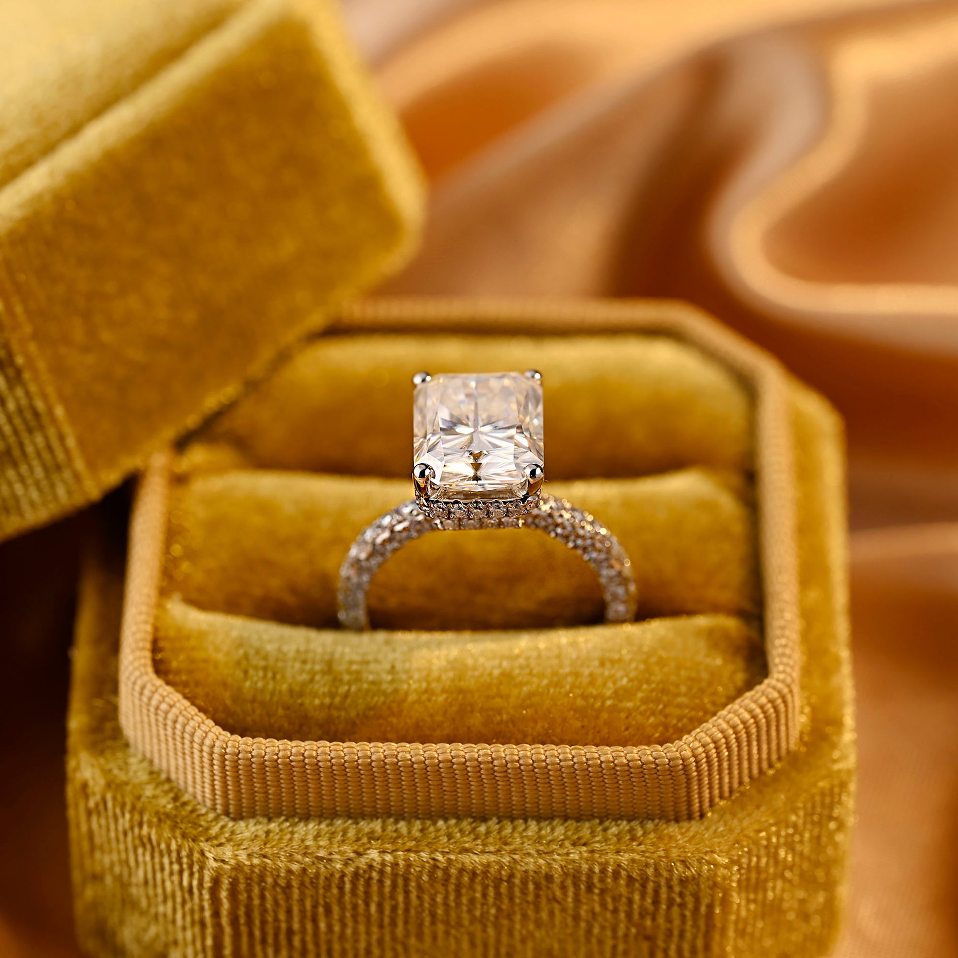 solid-gold-radiant-cut-moissanite-engagement-ring-three-raw-paved-ring