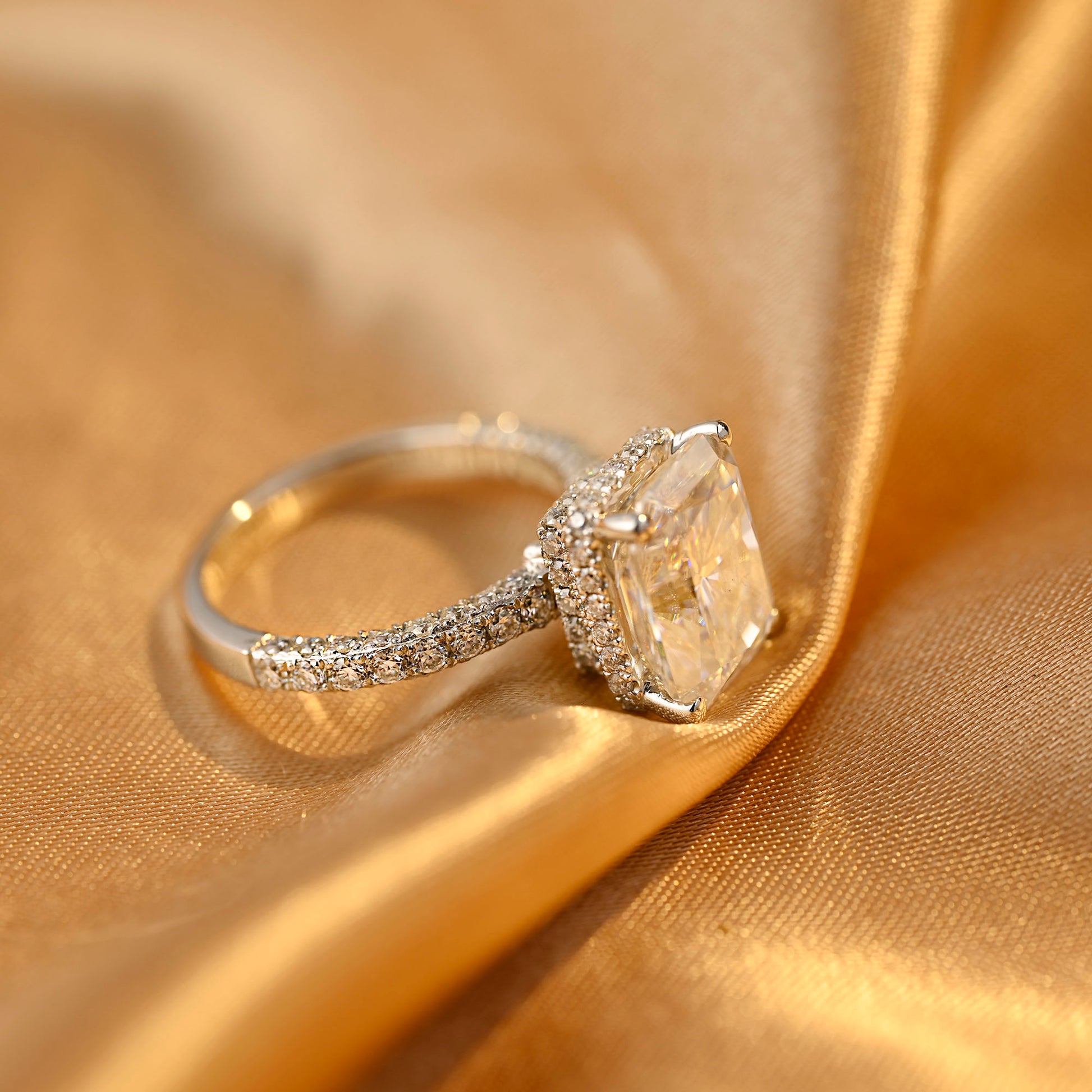 solid-gold-radiant-cut-moissanite-engagement-ring-three-raw-paved-ring