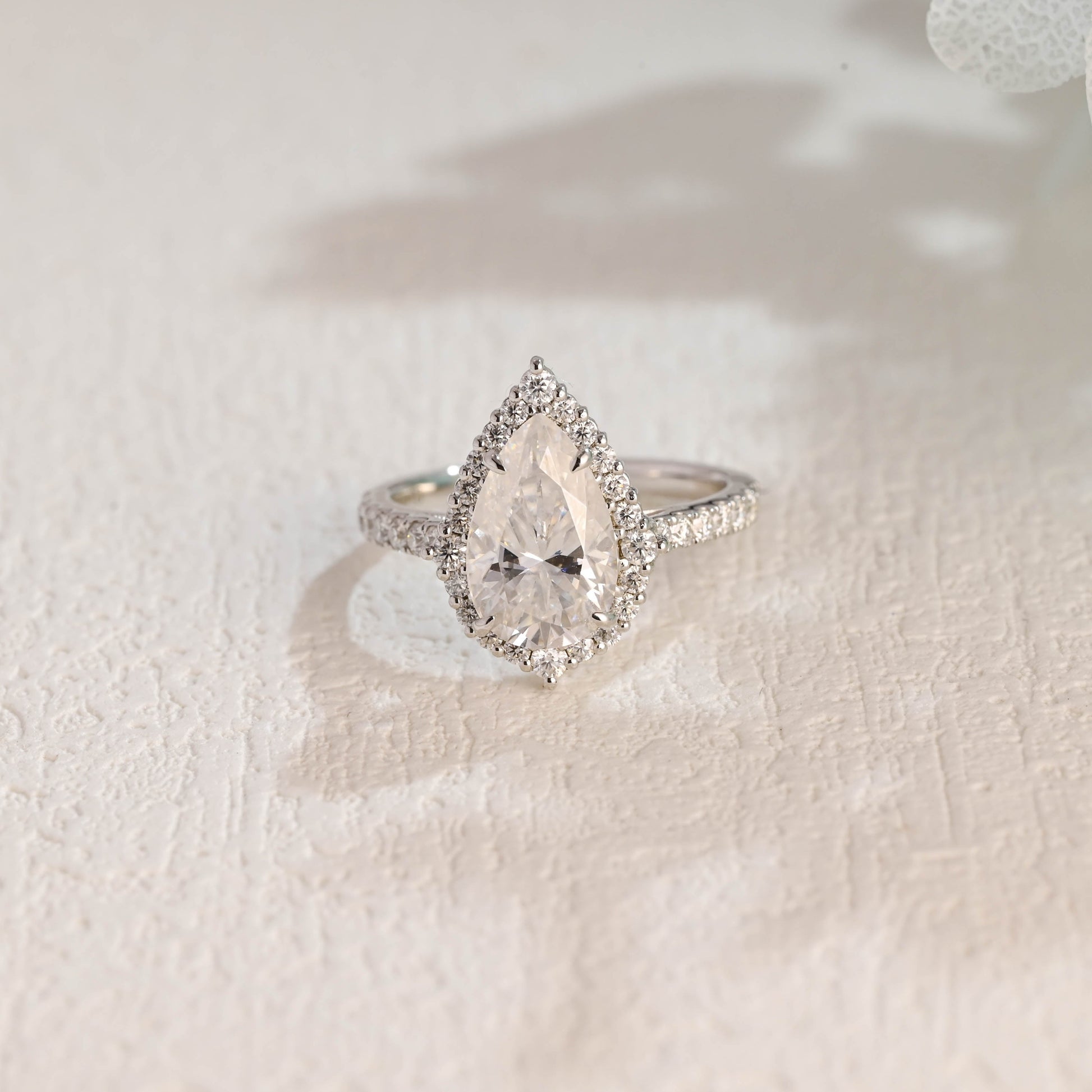 solid-gold-pear-cut-moissanite-engagement-ring-paved-halo-ring