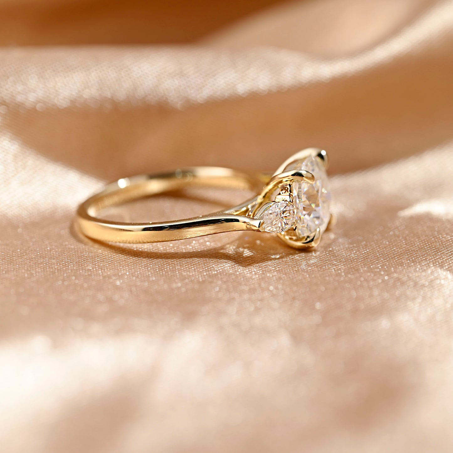 solid-gold-cushion-cut-moissanite-engagement-ring-three-stone-ring-pear-cut-ring