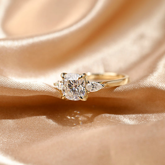 solid-gold-cushion-cut-moissanite-engagement-ring-three-stone-ring-pear-cut-ring