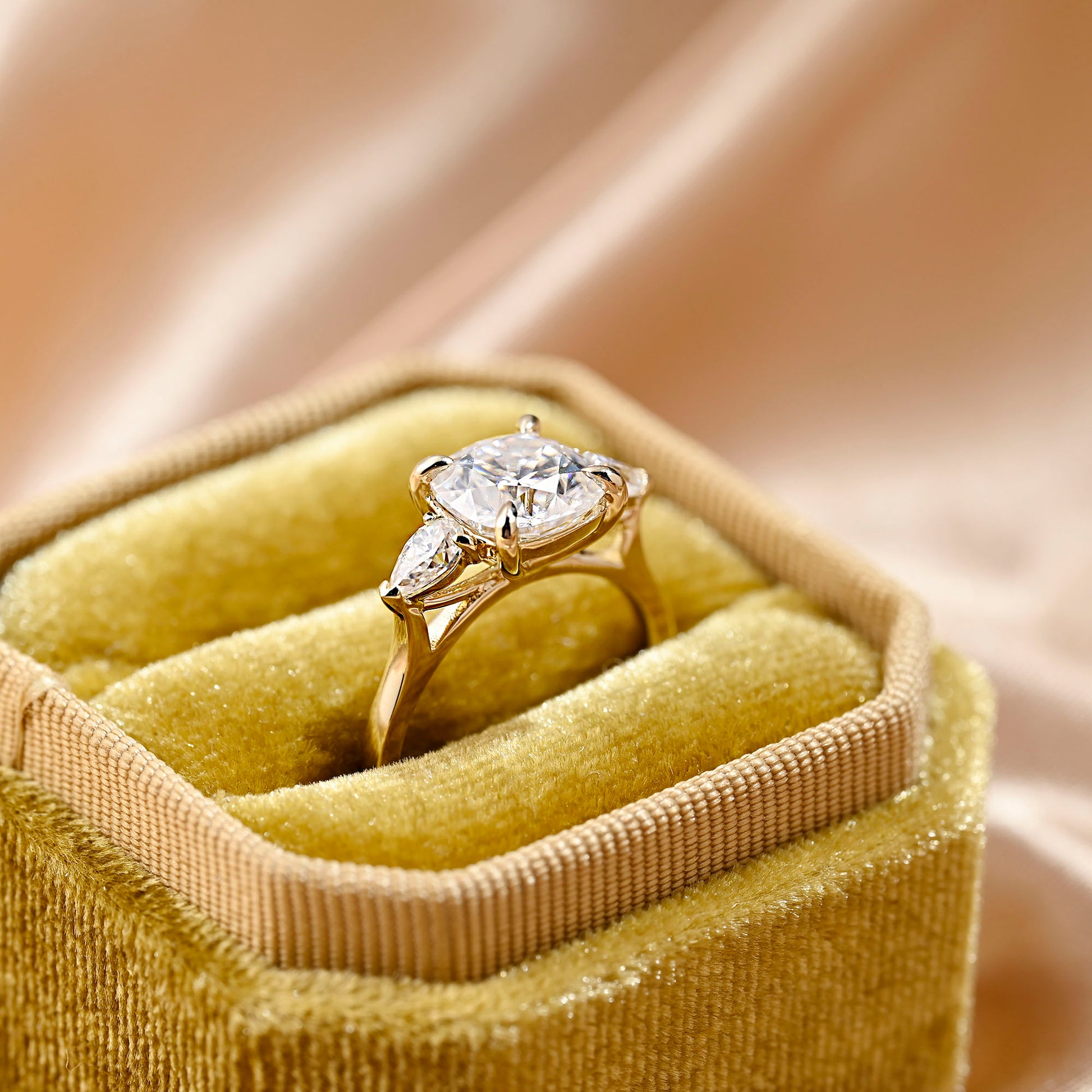 solid-gold-cushion-cut-moissanite-engagement-ring-three-stone-ring-pear-cut-ring