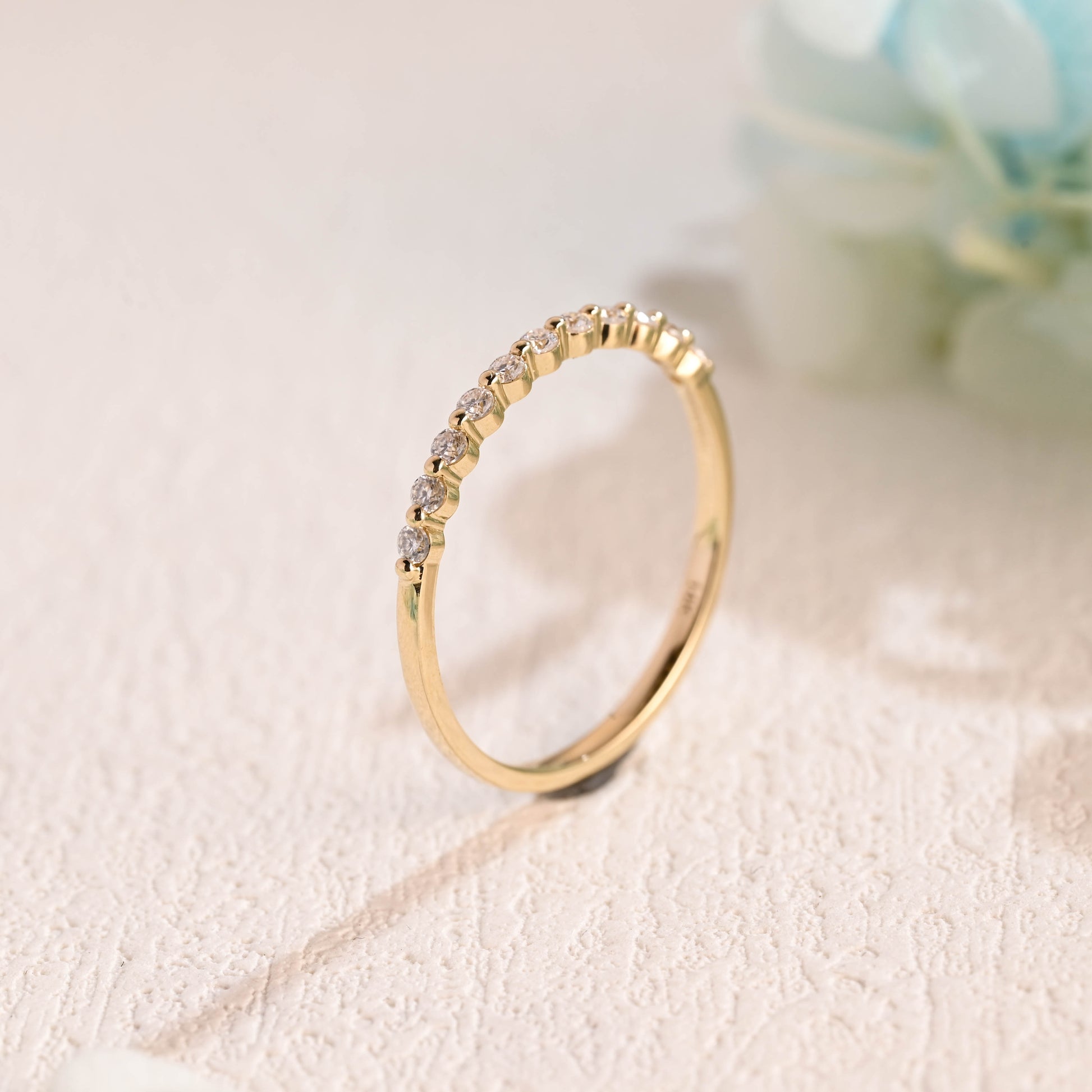 Solid-gold-round-moissanite-ring-band-half-eternity-band