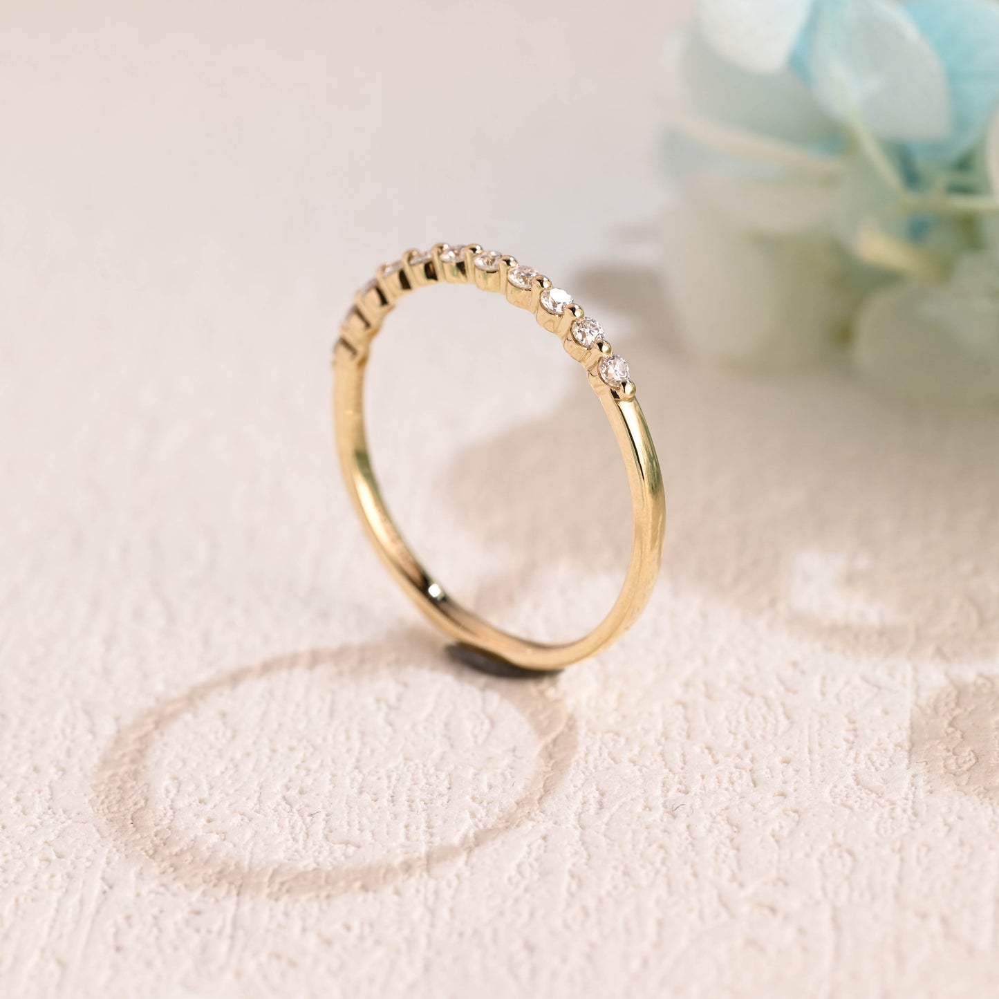 Solid-gold-round-moissanite-ring-band-half-eternity-wedding-band