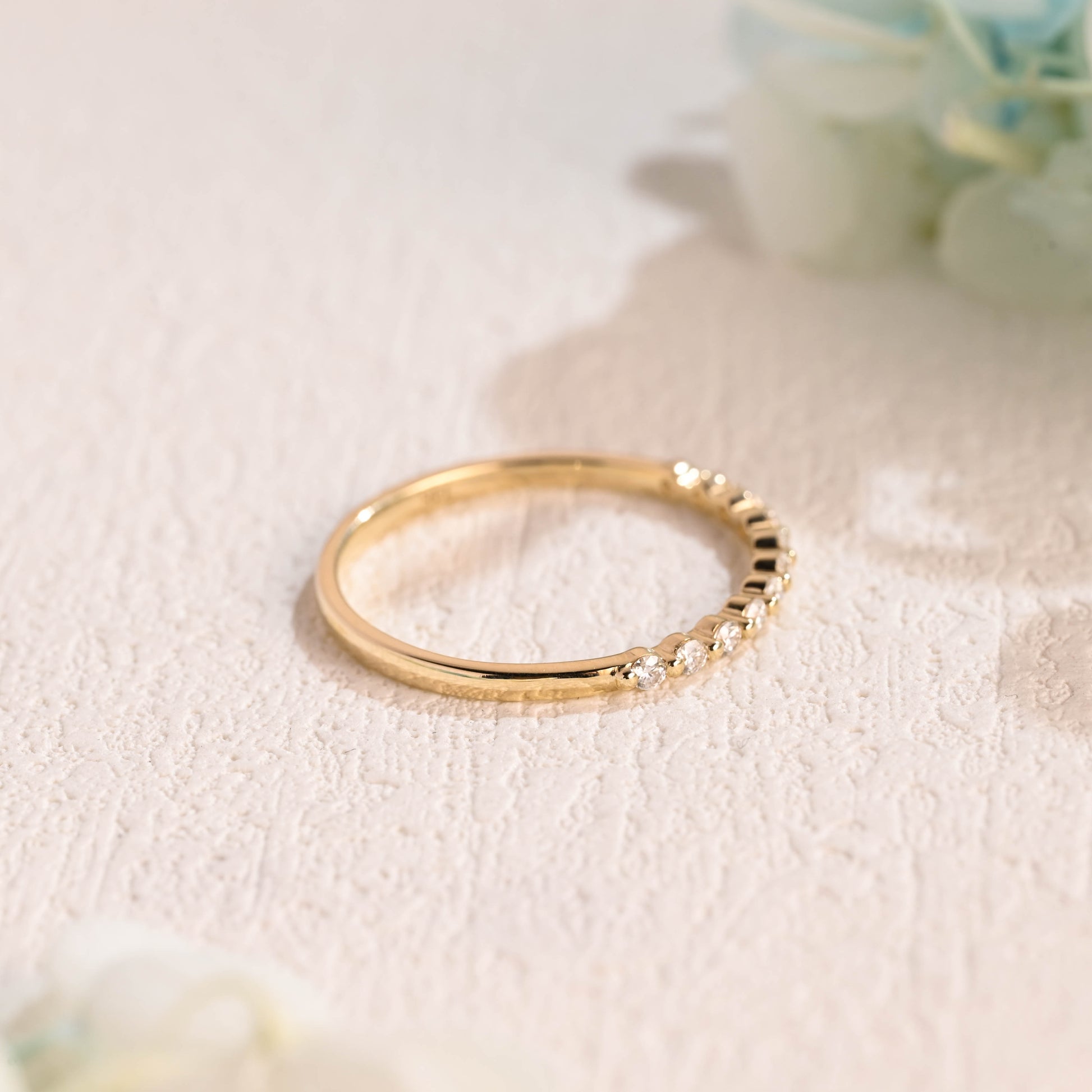 Solid-gold-round-moissanite-ring-band-half-eternity-wedding-band