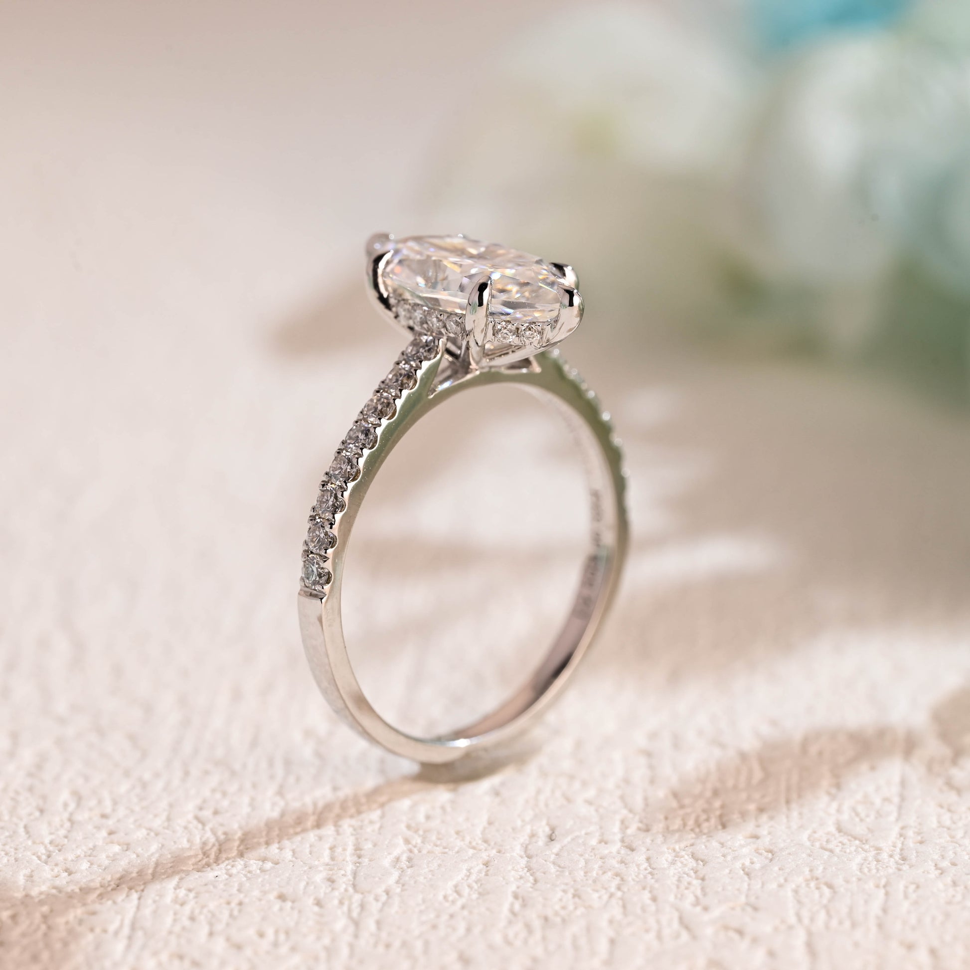 solid-gold-marquise-cut-moissanite-engagement-ring-cathedral-setting-hidden-halo