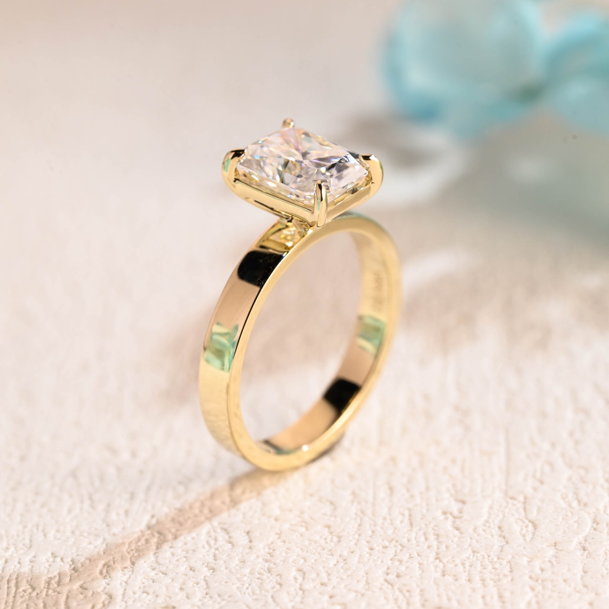 solid-gold-solitaire-radiant-cut-moissanite-engagement-ring