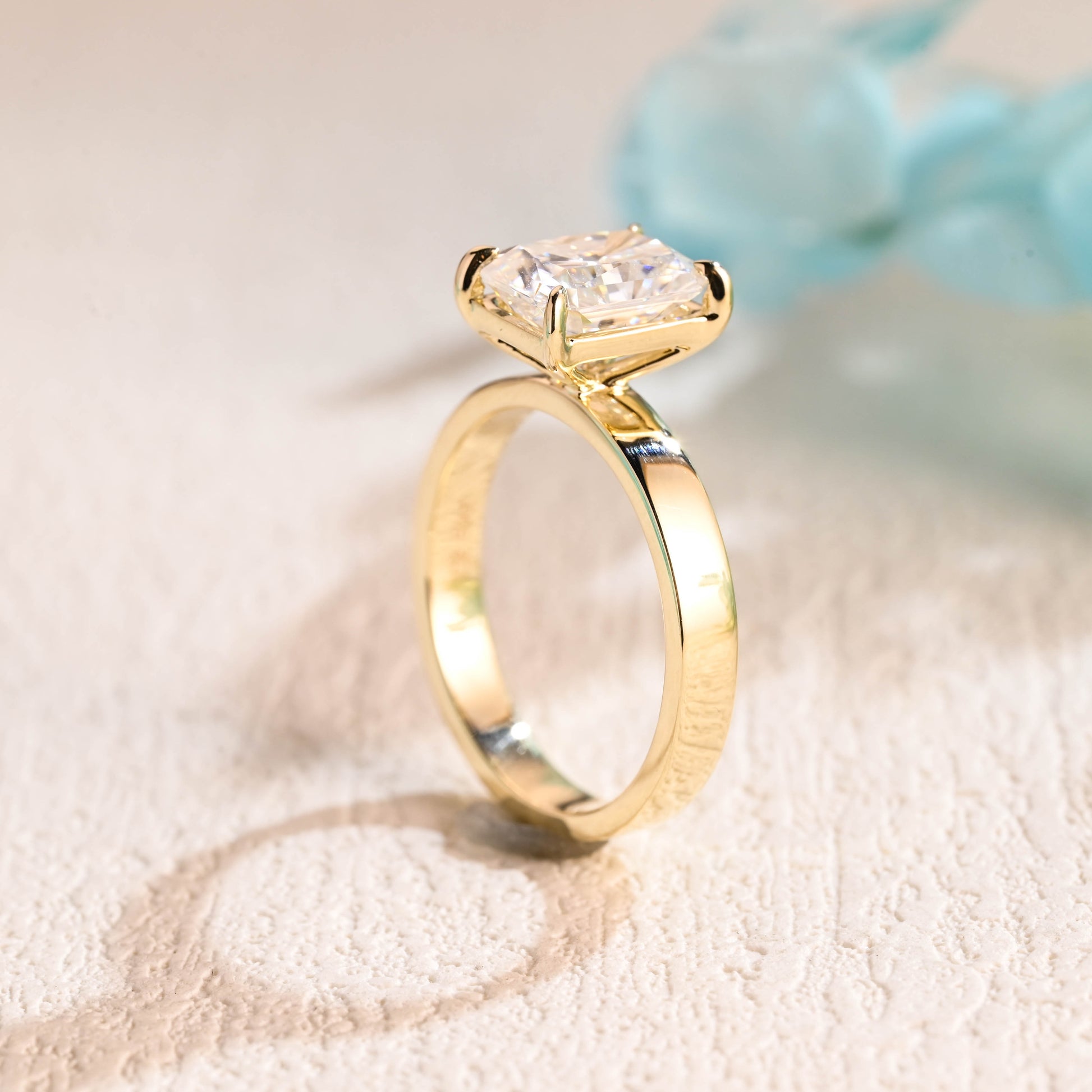 solid-gold-solitaire-radiant-cut-moissanite-engagement-ring