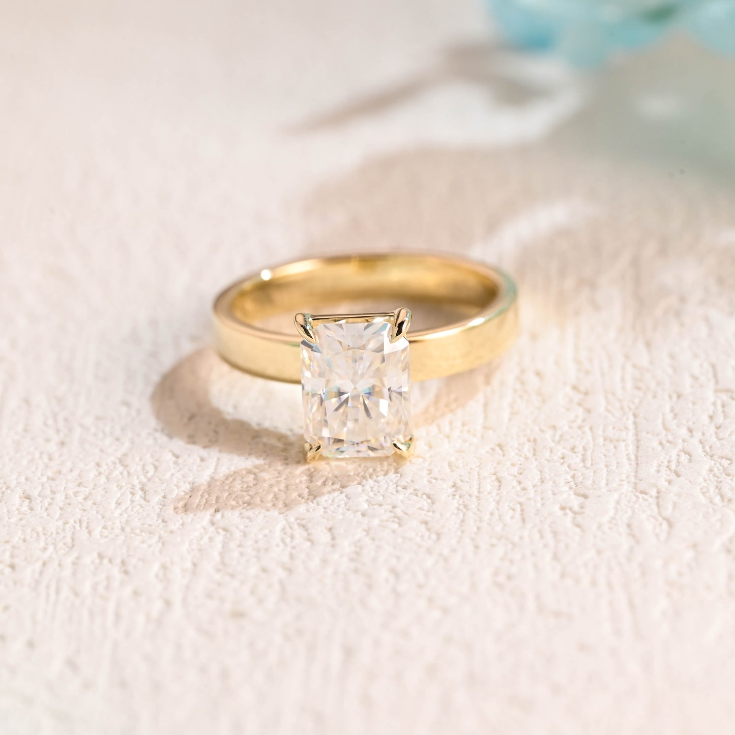 solid-gold-solitaire-radiant-cut-moissanite-engagement-ring