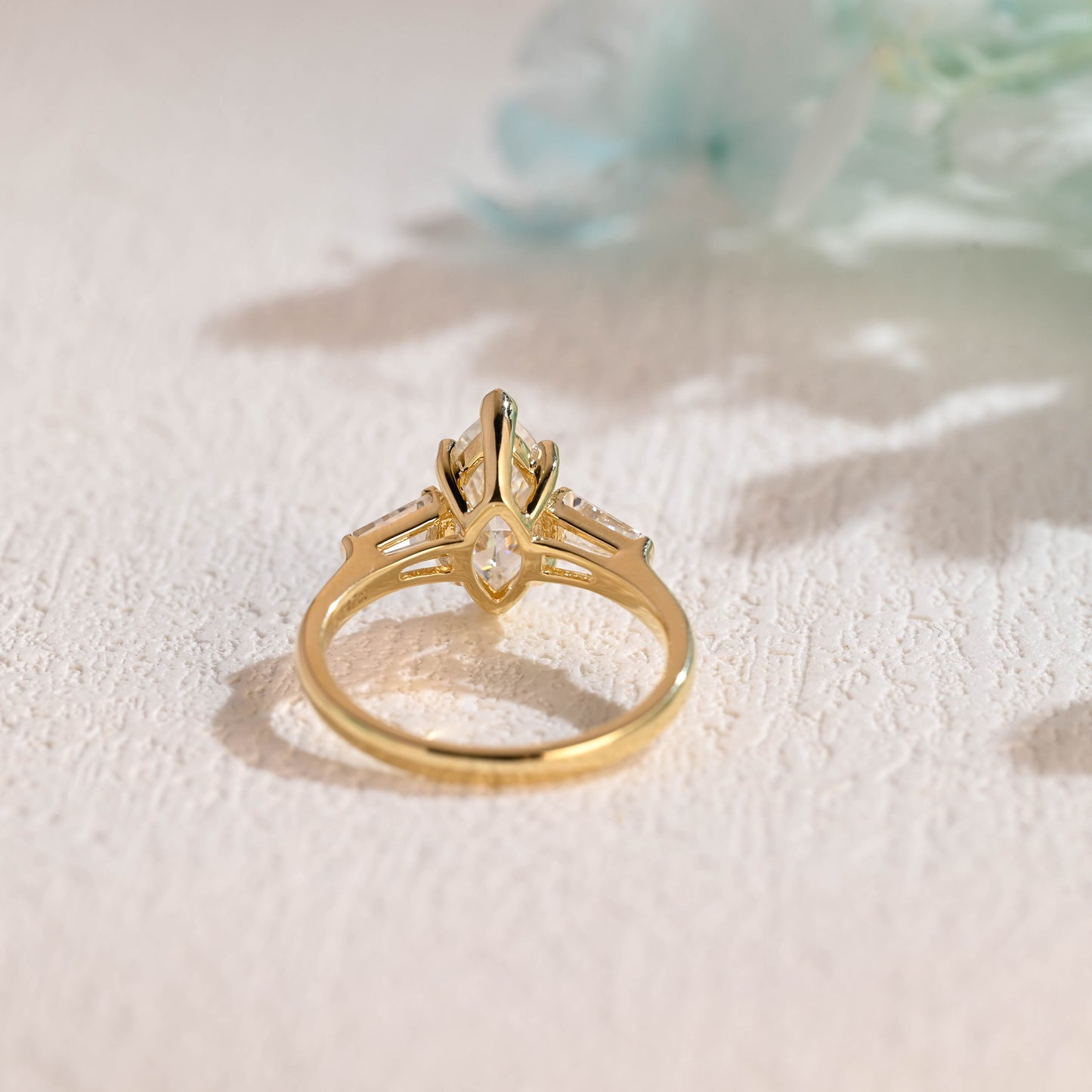 Solid-gold-three-stone-ring-marquise-cut-moissanite-engagement-ring