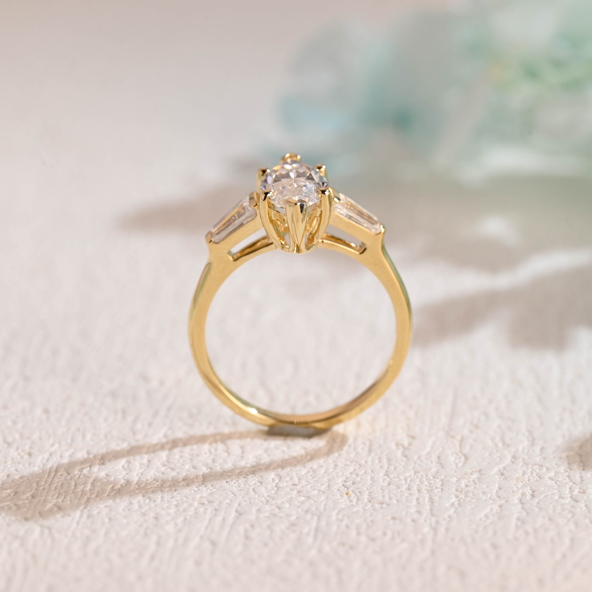 Solid-gold-three-stone-ring-marquise-cut-moissanite-engagement-ring