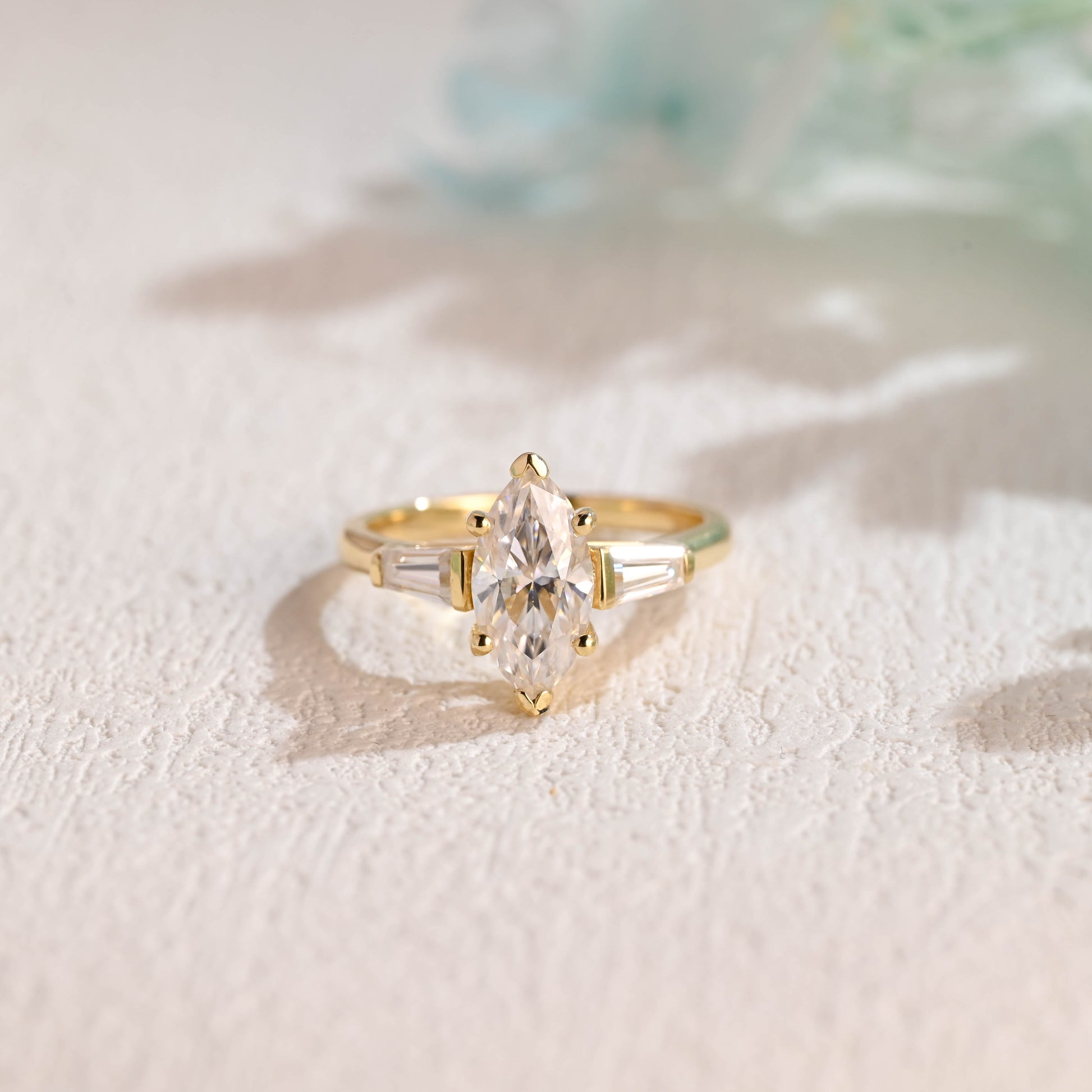 Solid-gold-three-stone-ring-marquise-cut-moissanite-engagement-ring